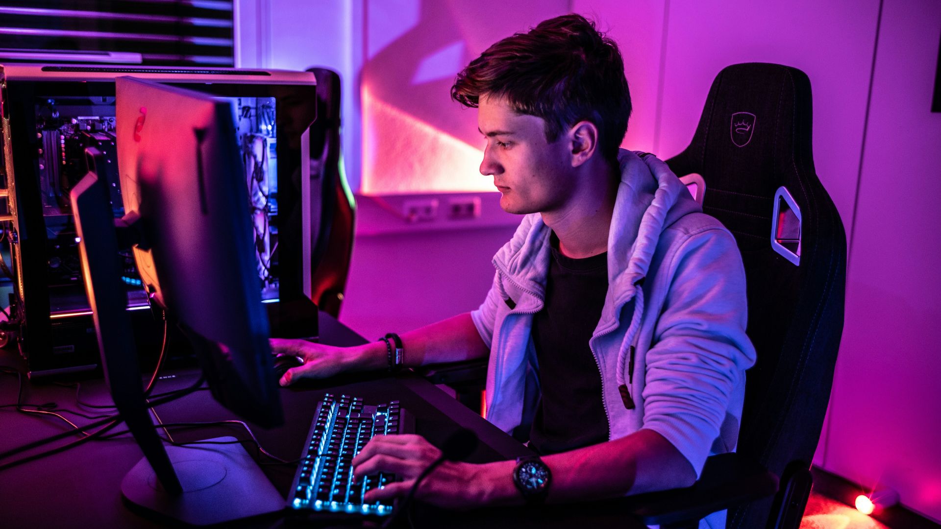 a man sitting in front of a computer keyboard