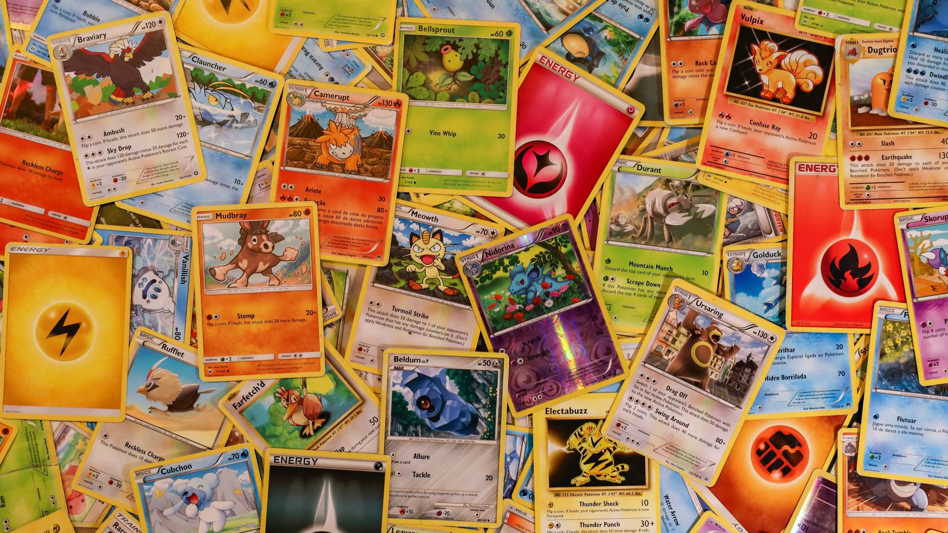 red ceramic mug on brown wooden table