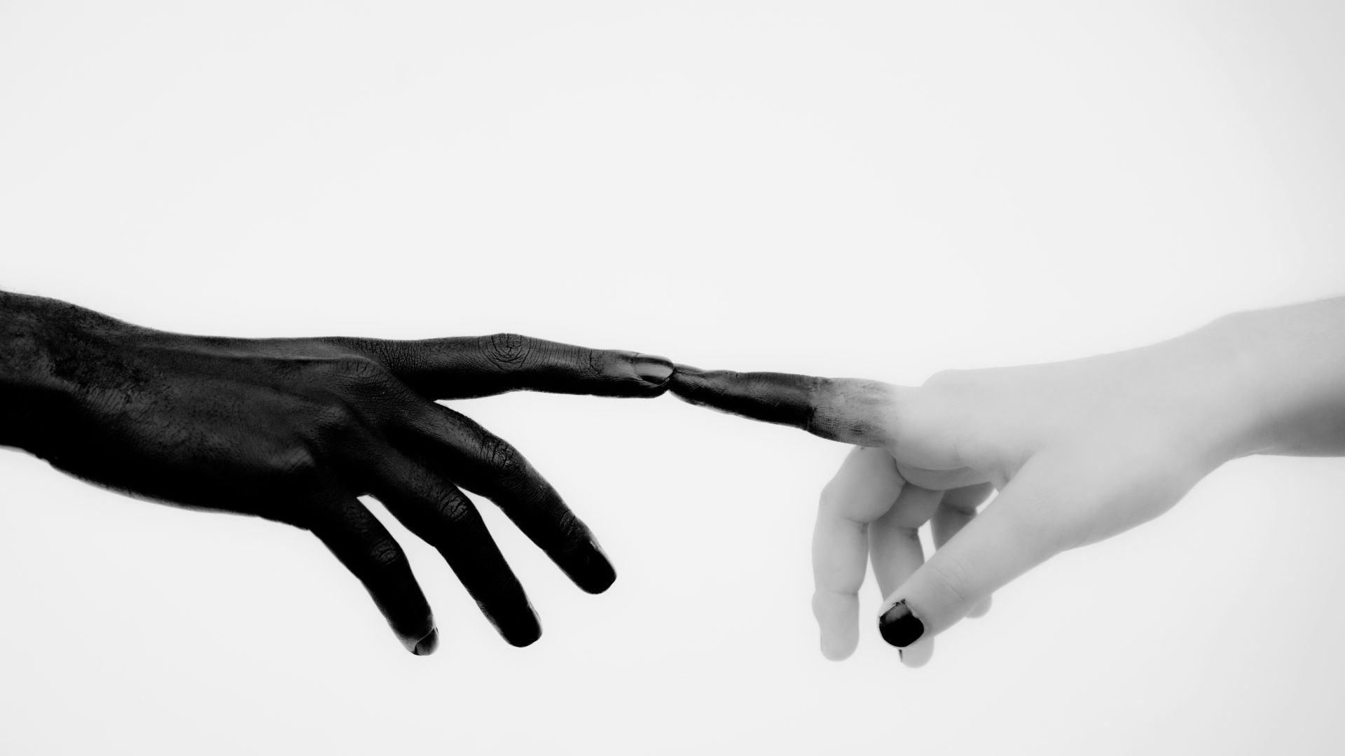 persons hand with white manicure