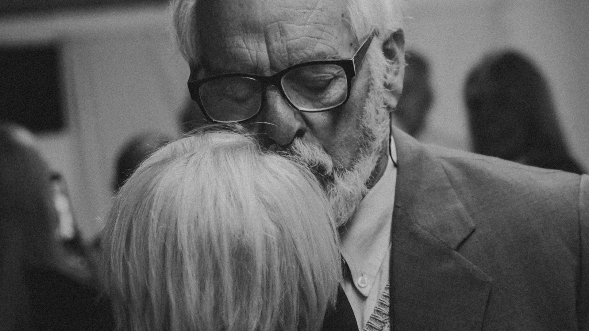 a black and white photo of a man and a woman