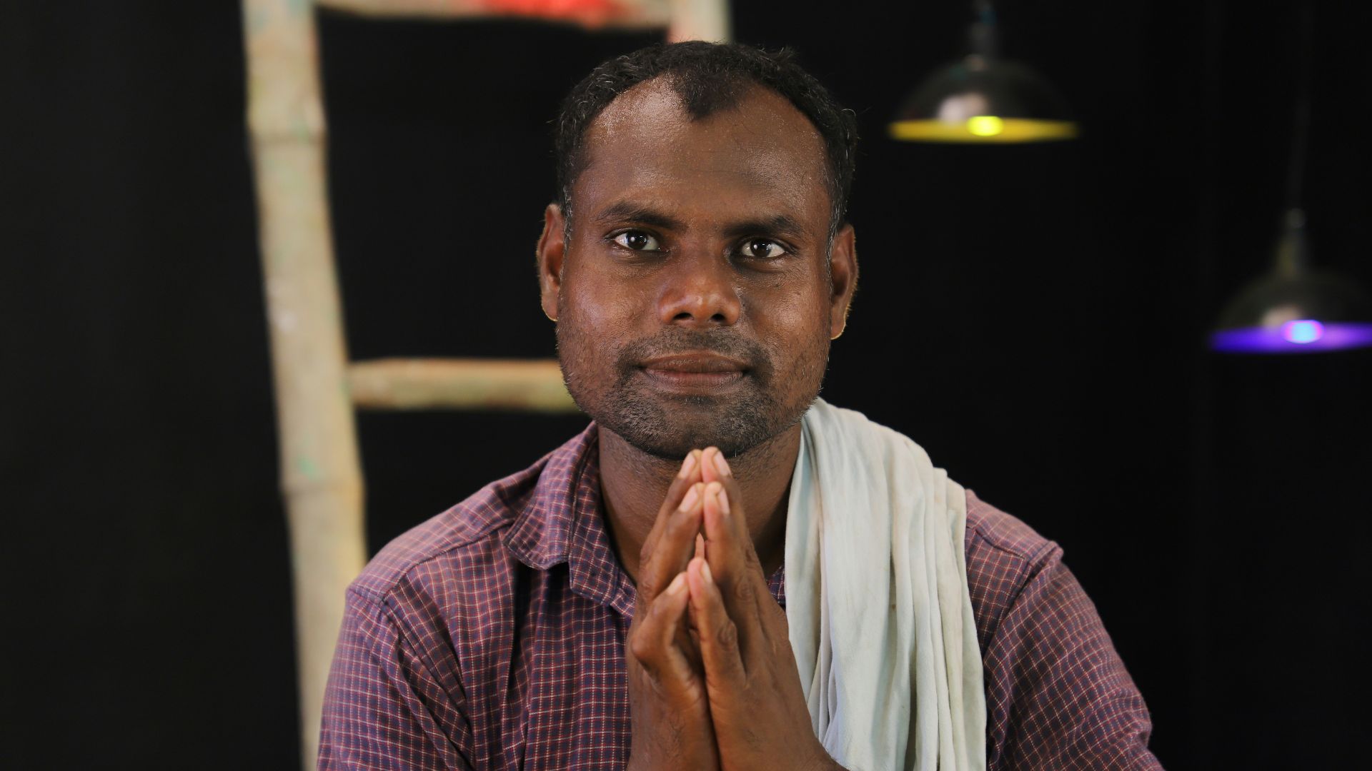 man in white shirt and red and white checked button up shirt