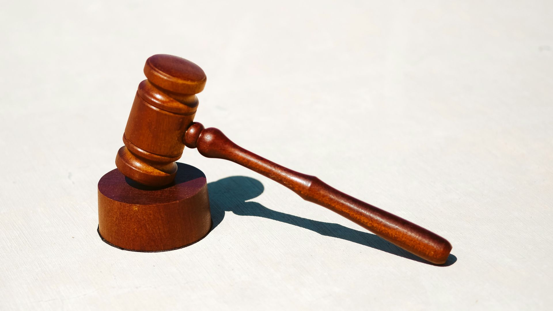 brown wooden tool on white surface