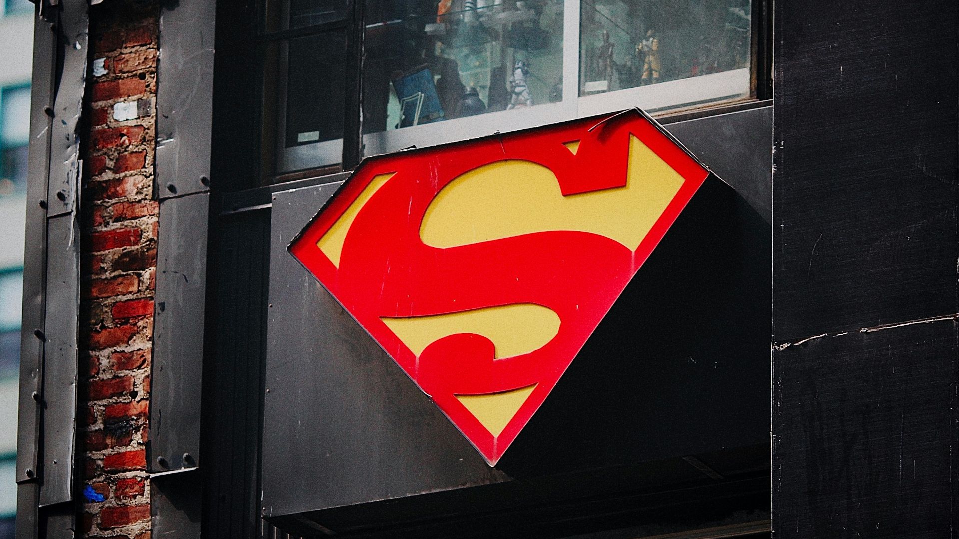 red and yellow heart sticker on black wooden door
