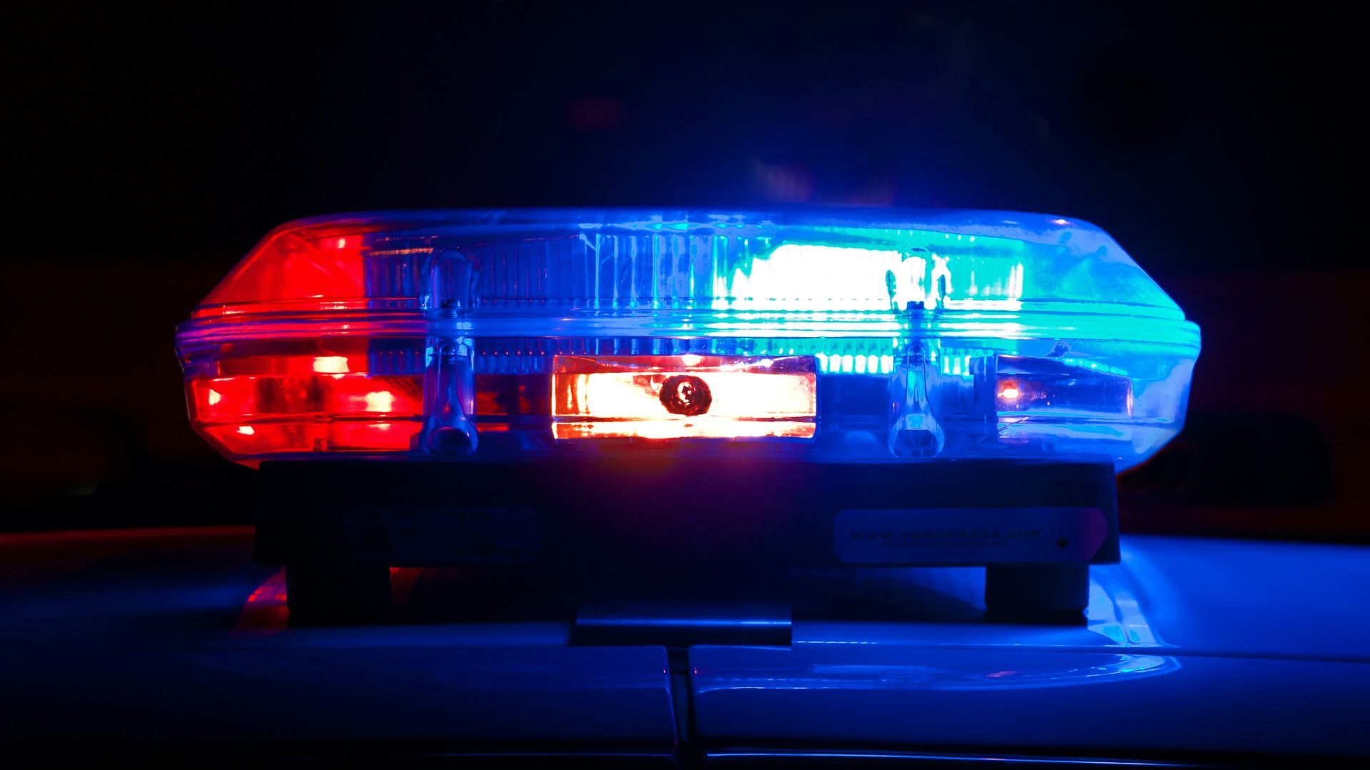 blue bmw car in a dark room