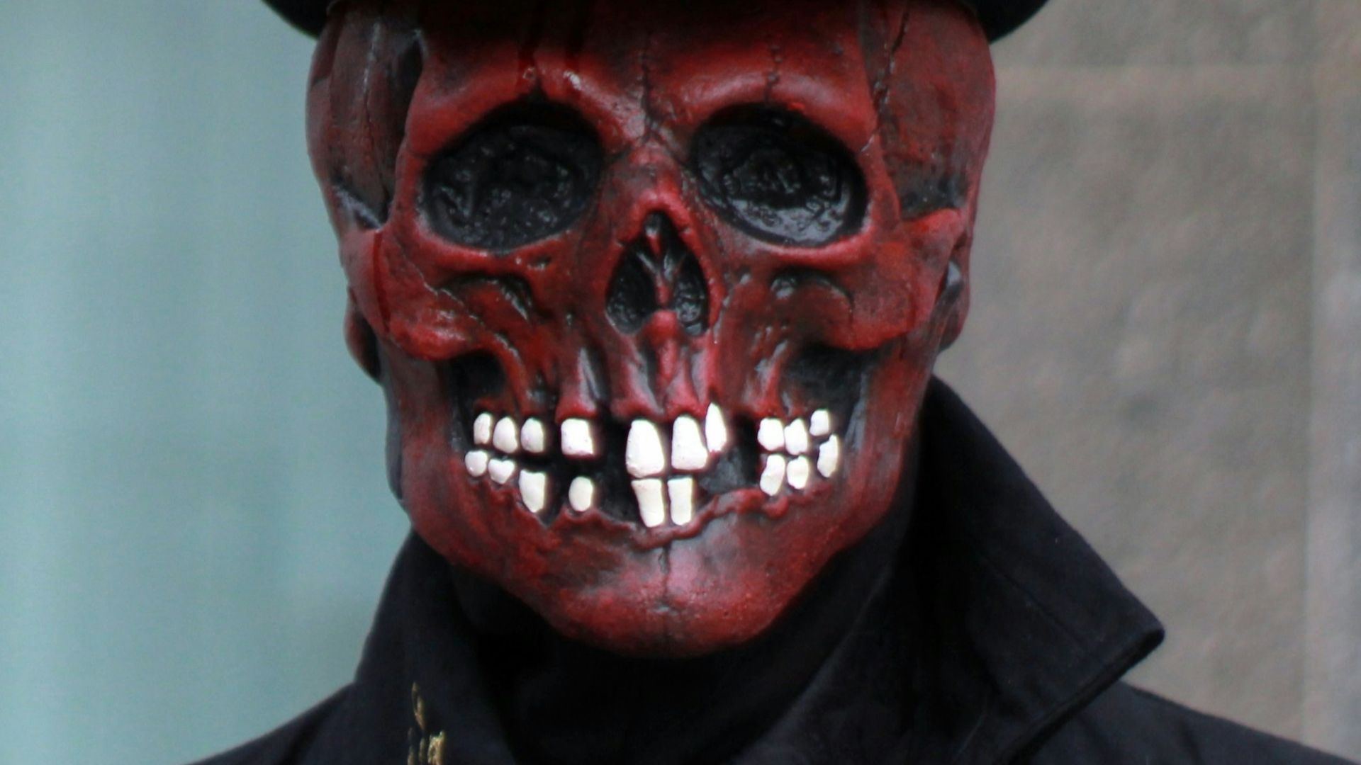 a man in a top hat with a skull on his face