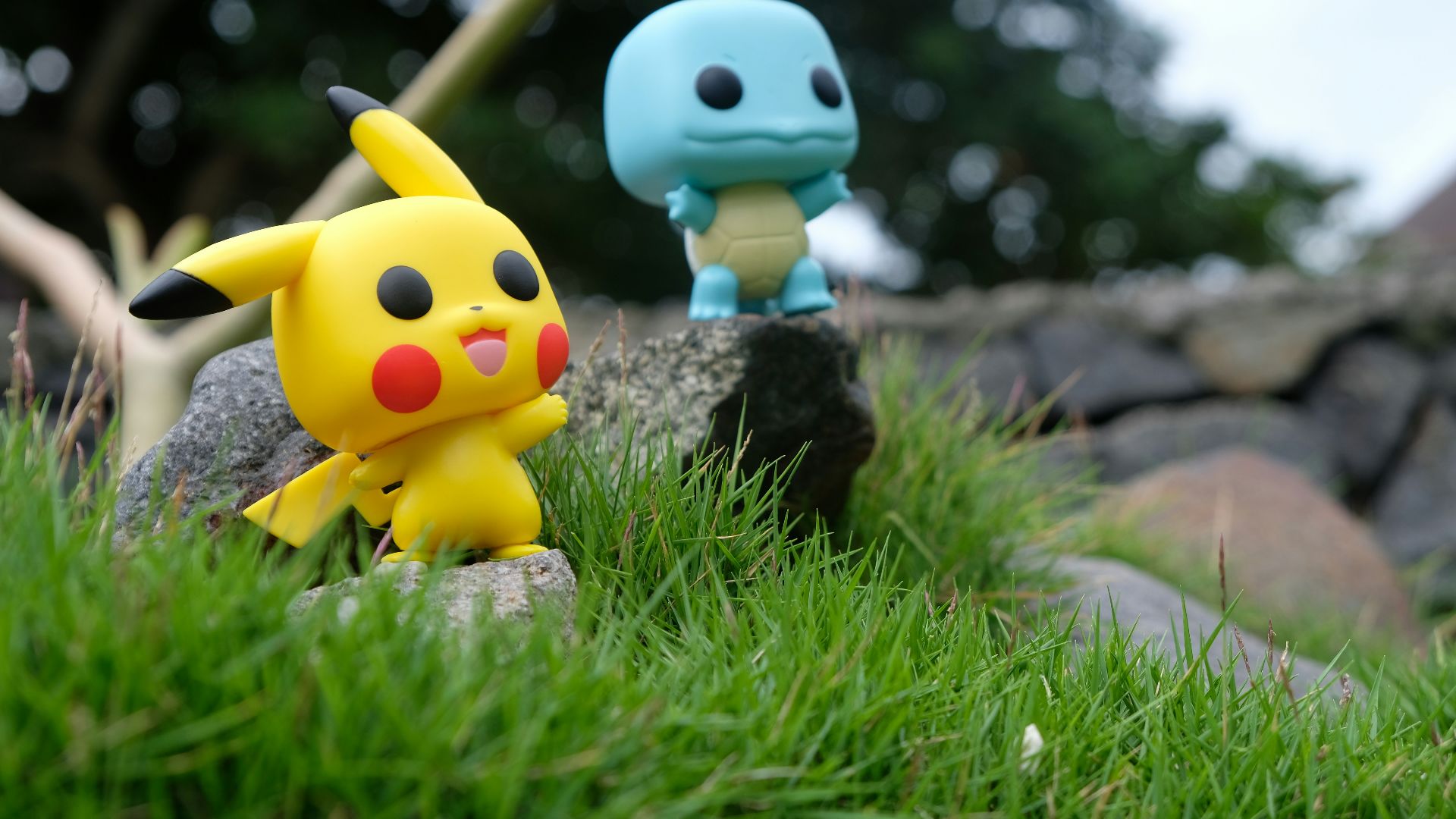 yellow and white duck plush toy on green grass during daytime