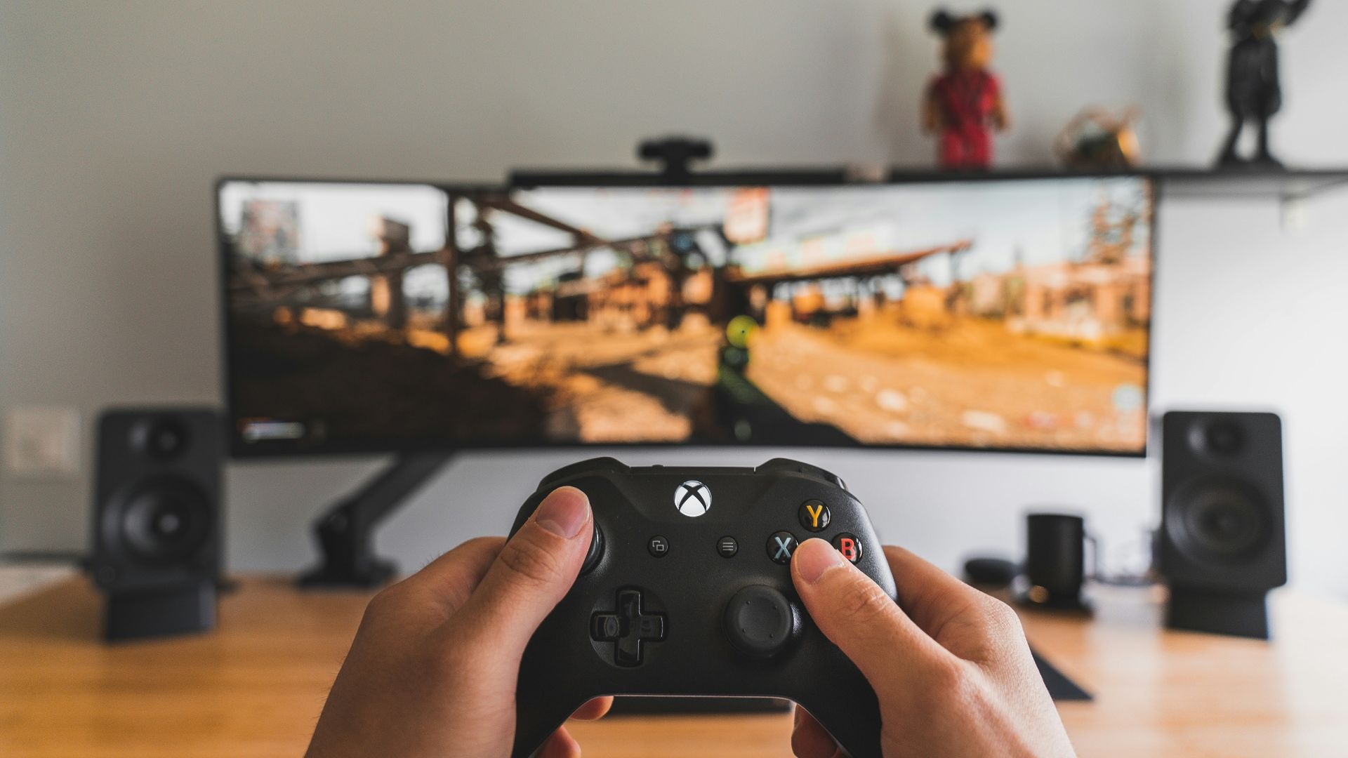 person holding black game controller