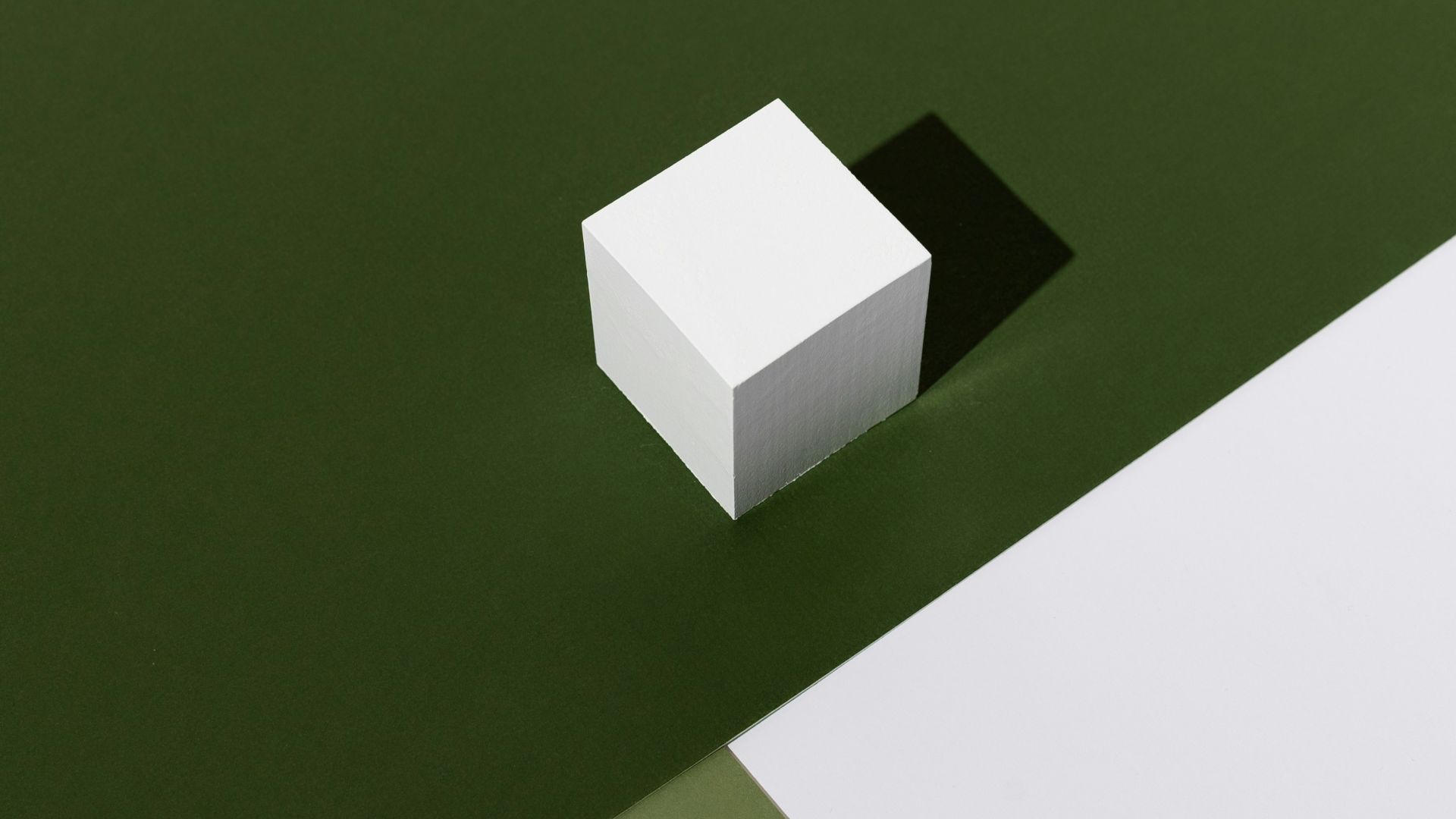 white box on green table
