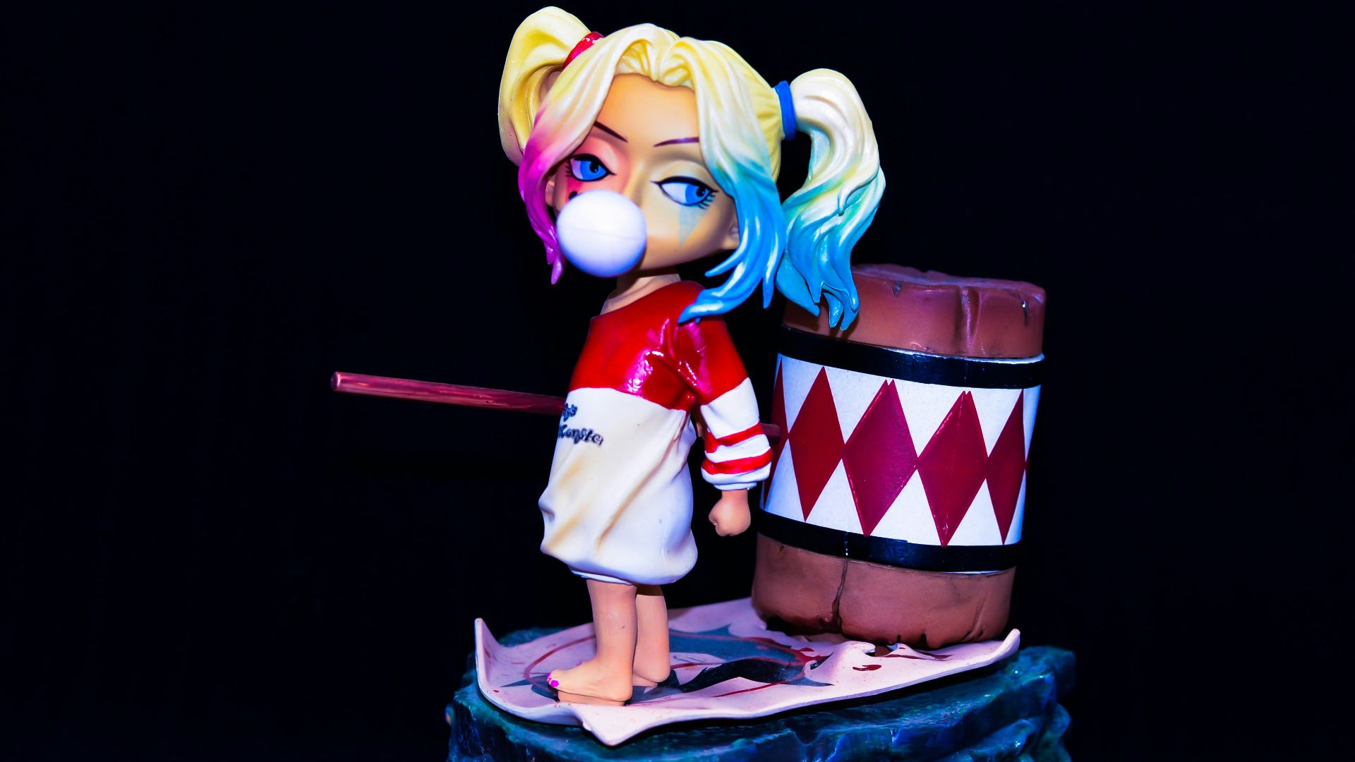 yellow haired girl in red and white dress holding red and white gift box