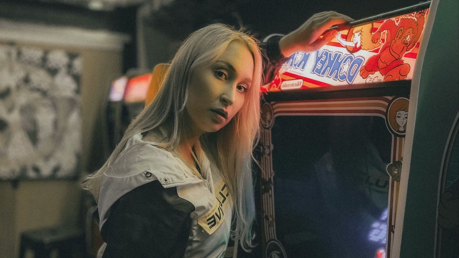 woman in black jacket sitting on train seat