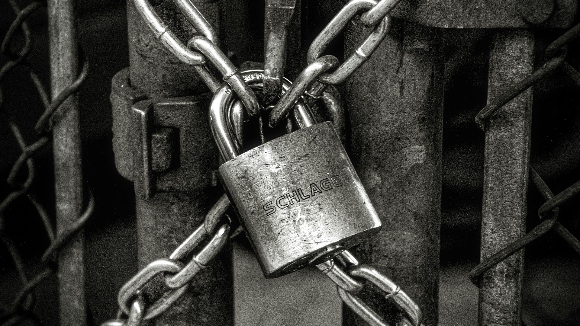 gray steel chain locked on gate