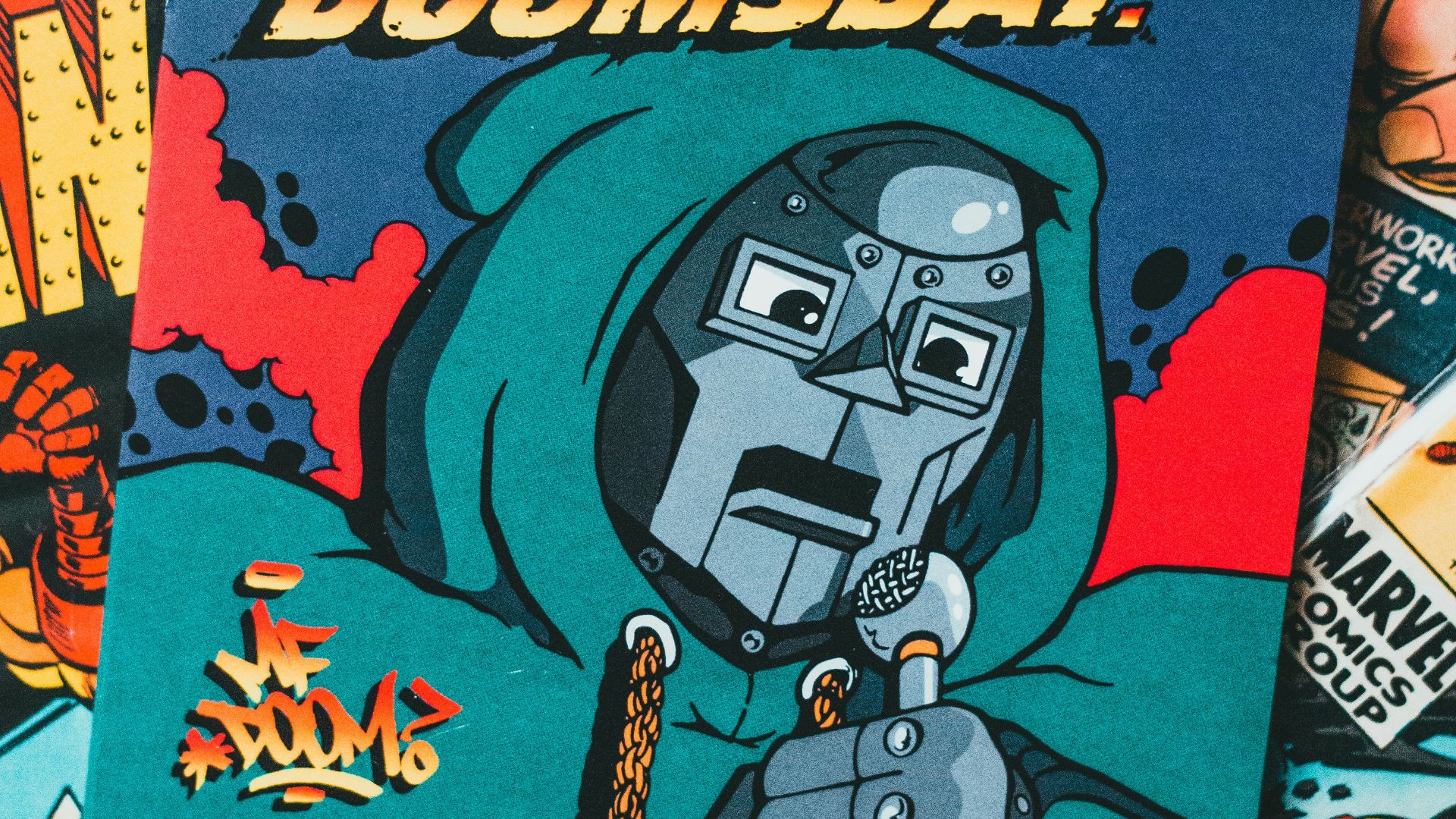 a pile of comic books sitting on top of a table