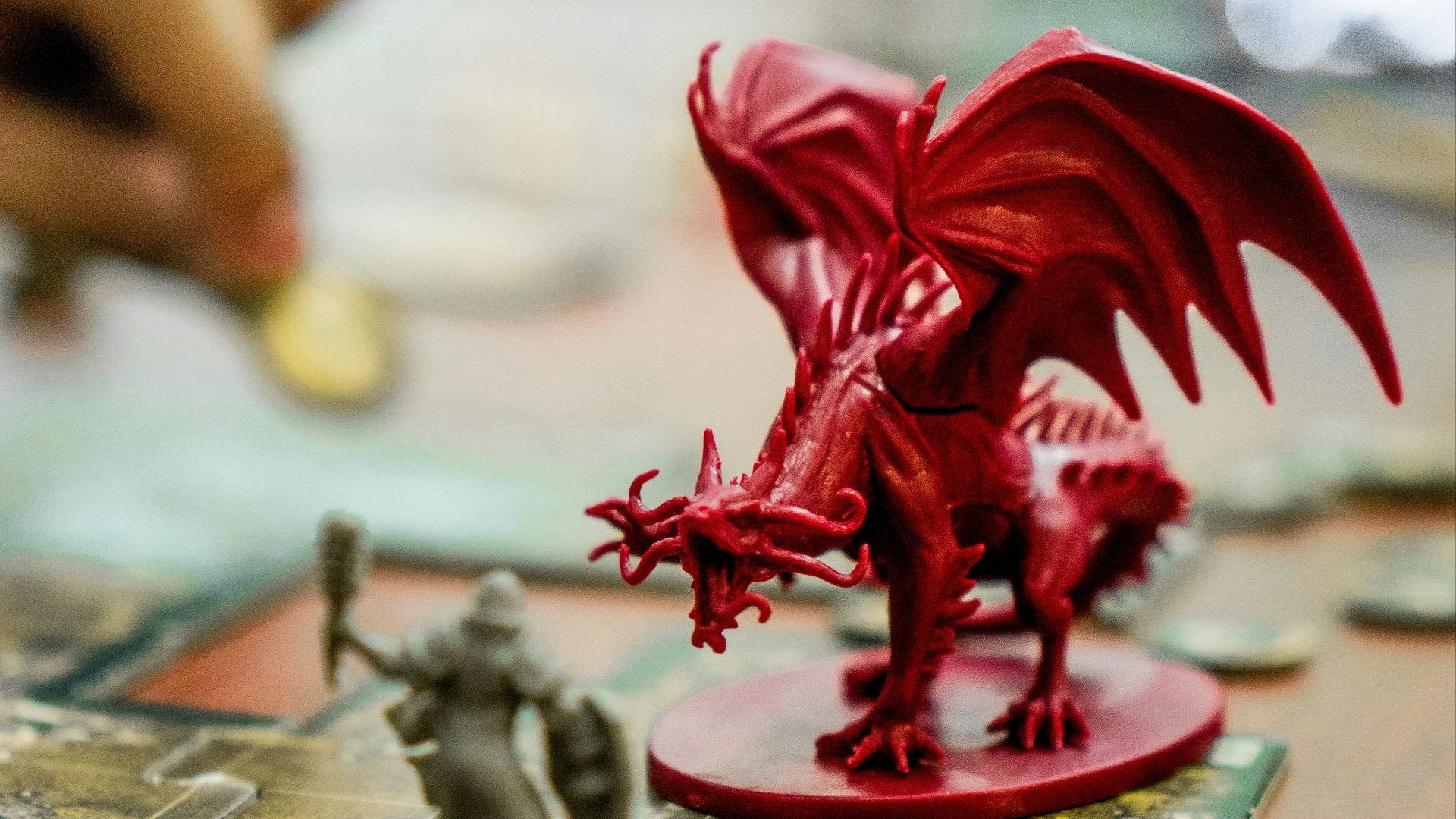 red dragon action figure on table