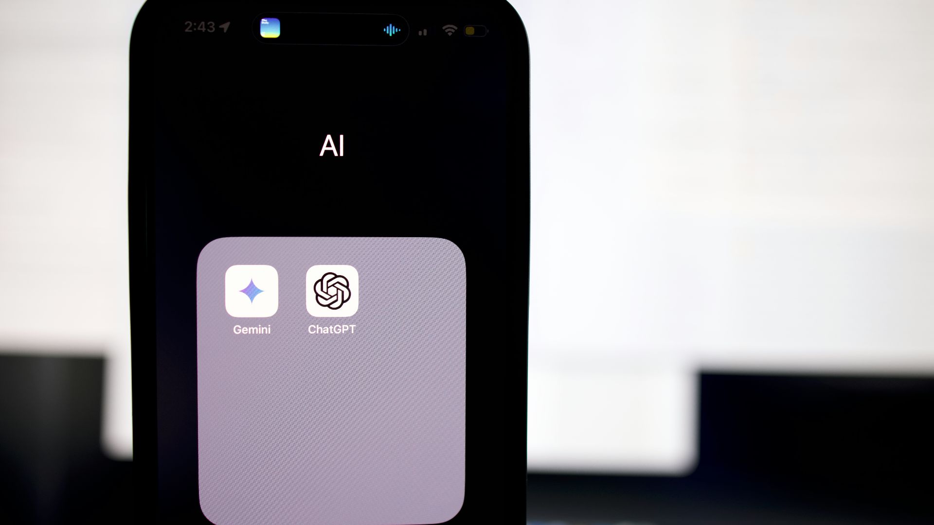 a close up of a cell phone with an ai button