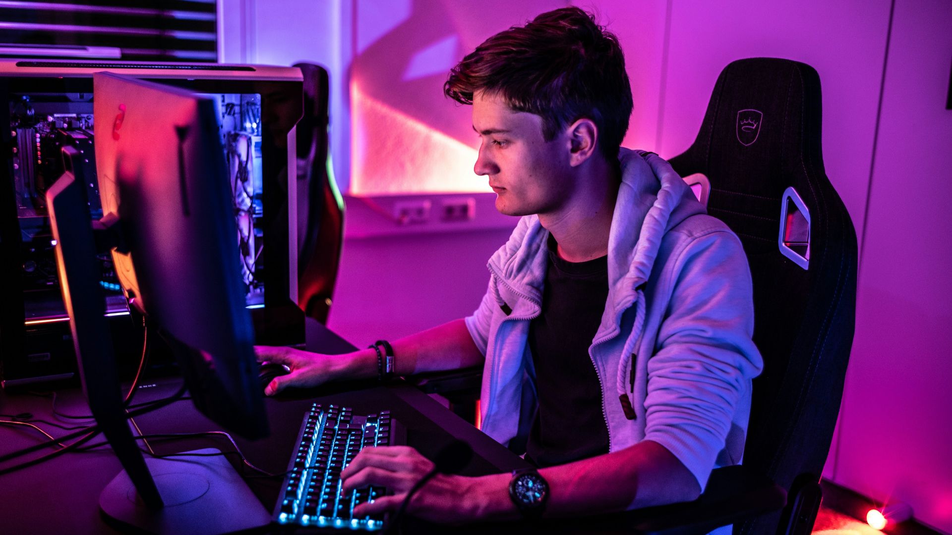 a man sitting in front of a computer keyboard