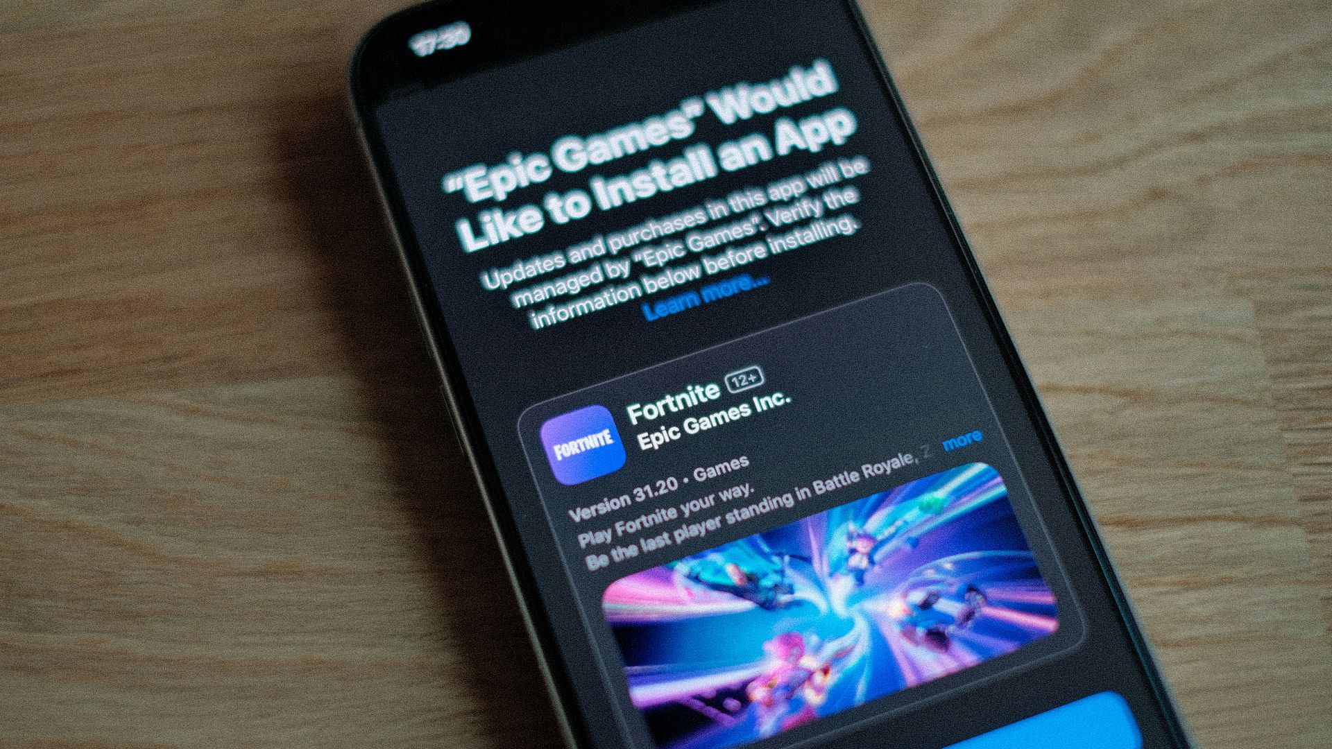 A cell phone sitting on top of a wooden table
