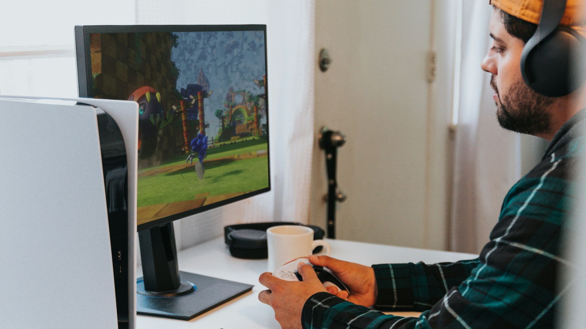 a person wearing a mask and sitting at a desk