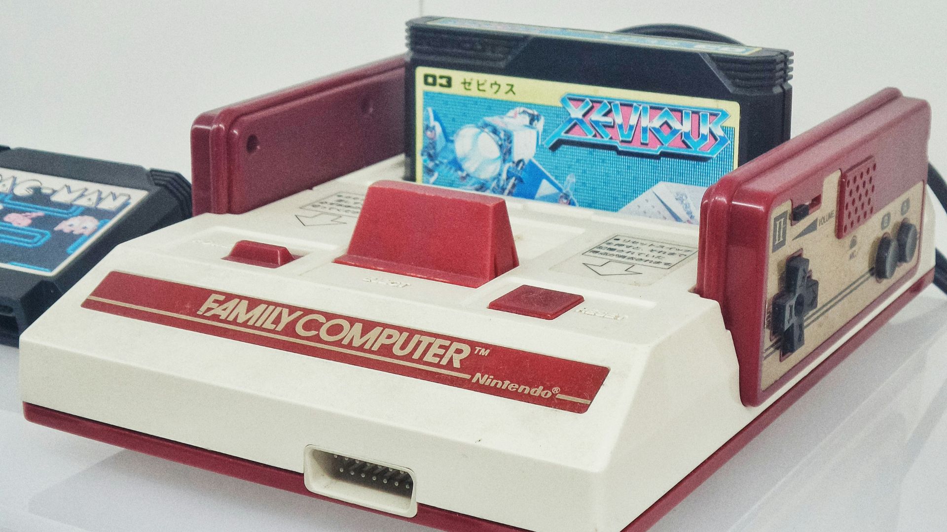 red and white Nintendo Family Computer console