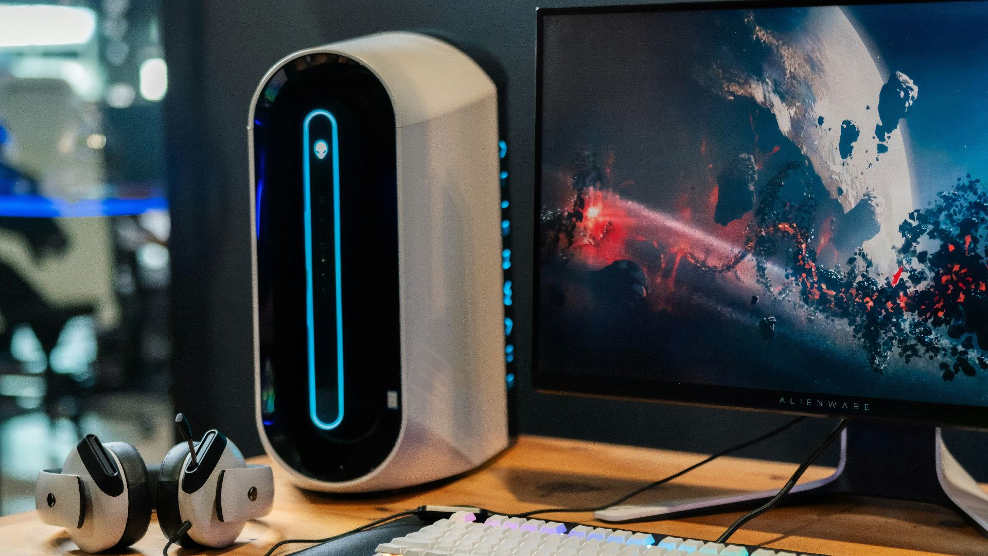 black flat screen computer monitor beside white computer keyboard