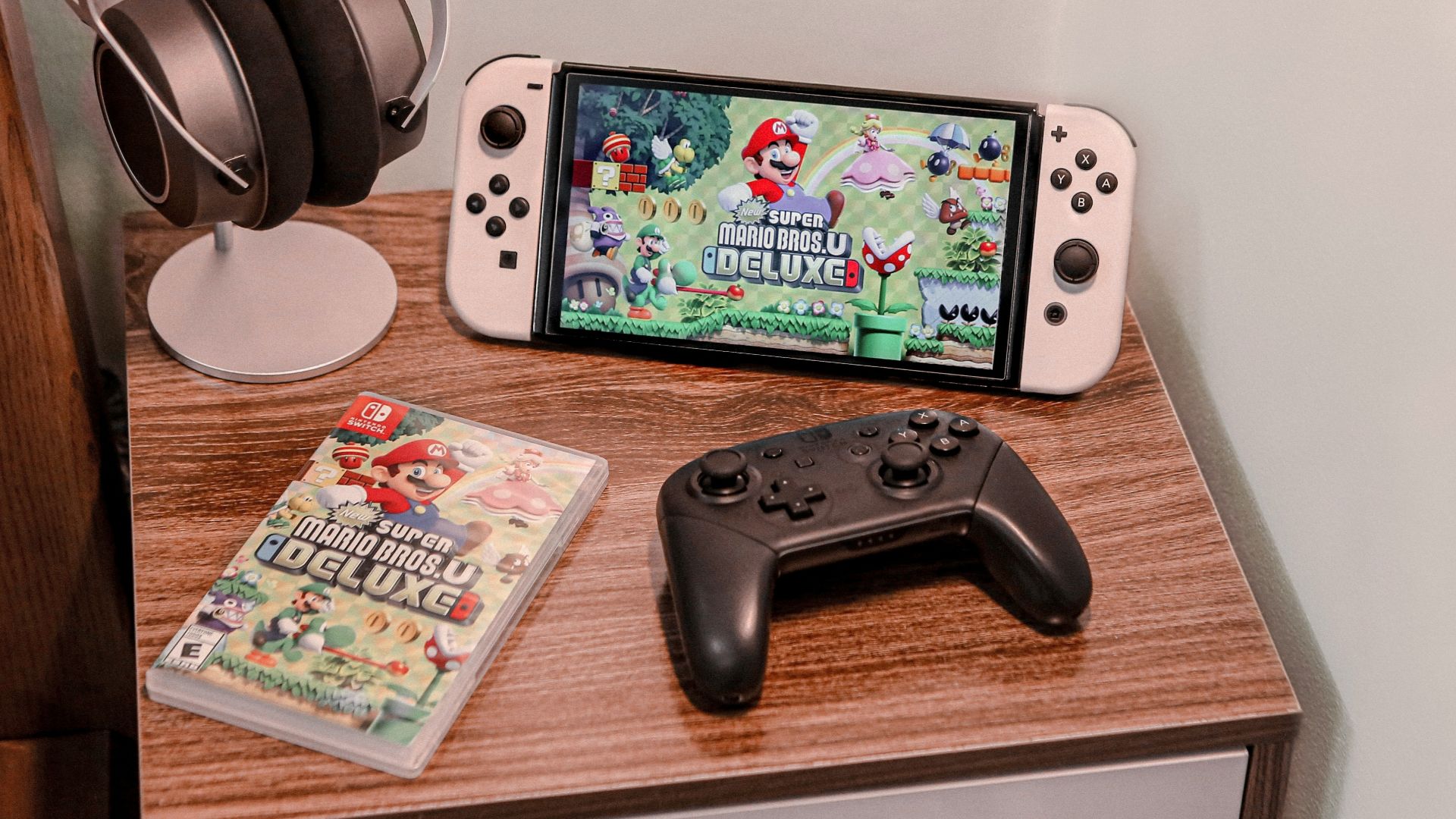 a nintendo wii game system sitting on top of a wooden table