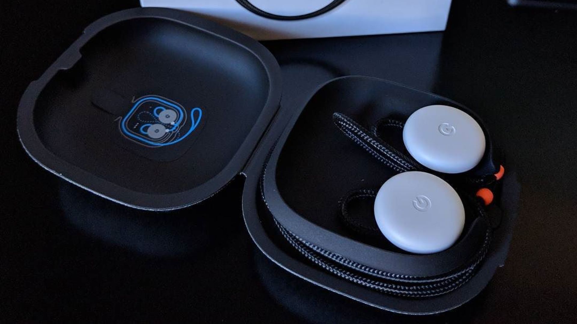 File:Pixel Buds in charging case with product box.jpg