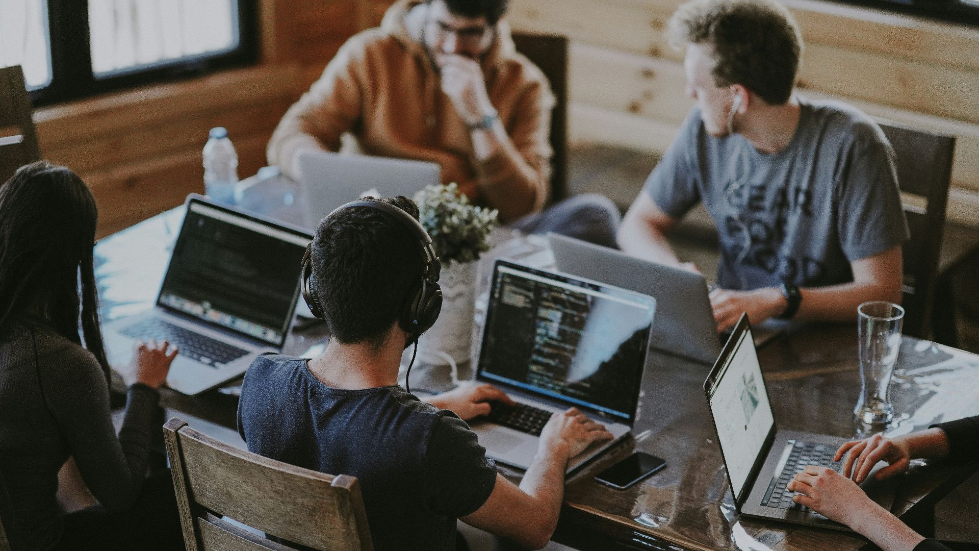 group of people using laptop computer