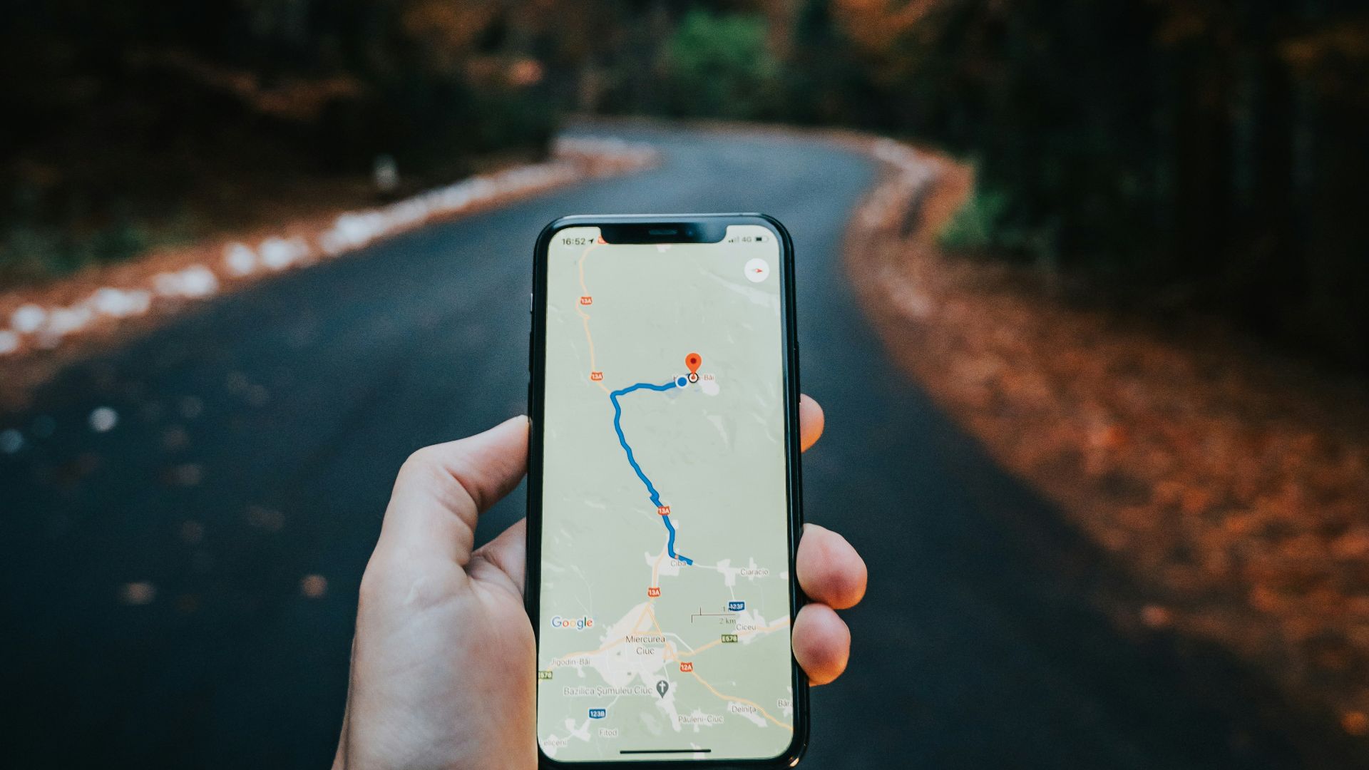 person holding white iphone 5 c