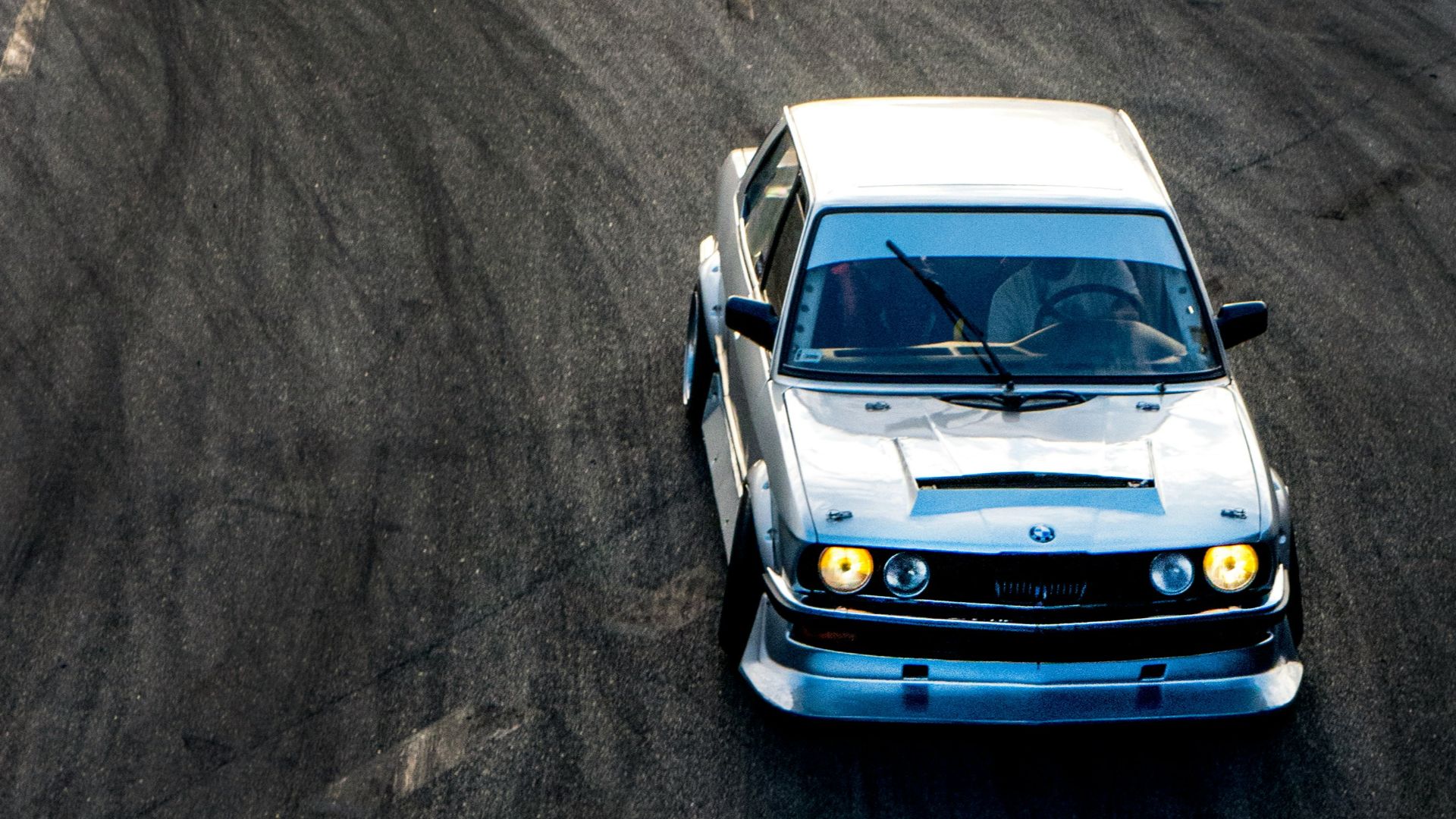 white car on gray asphalt road