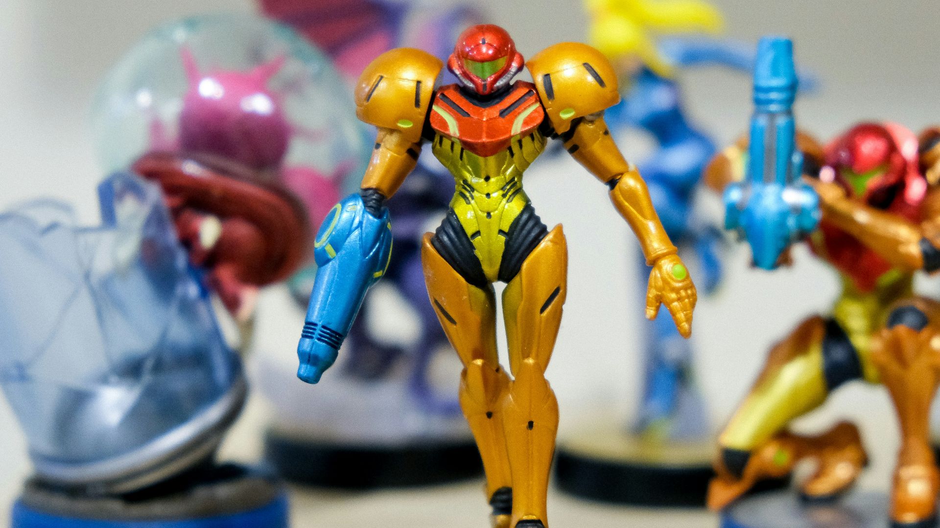 man wearing yellow and red costume character scale model