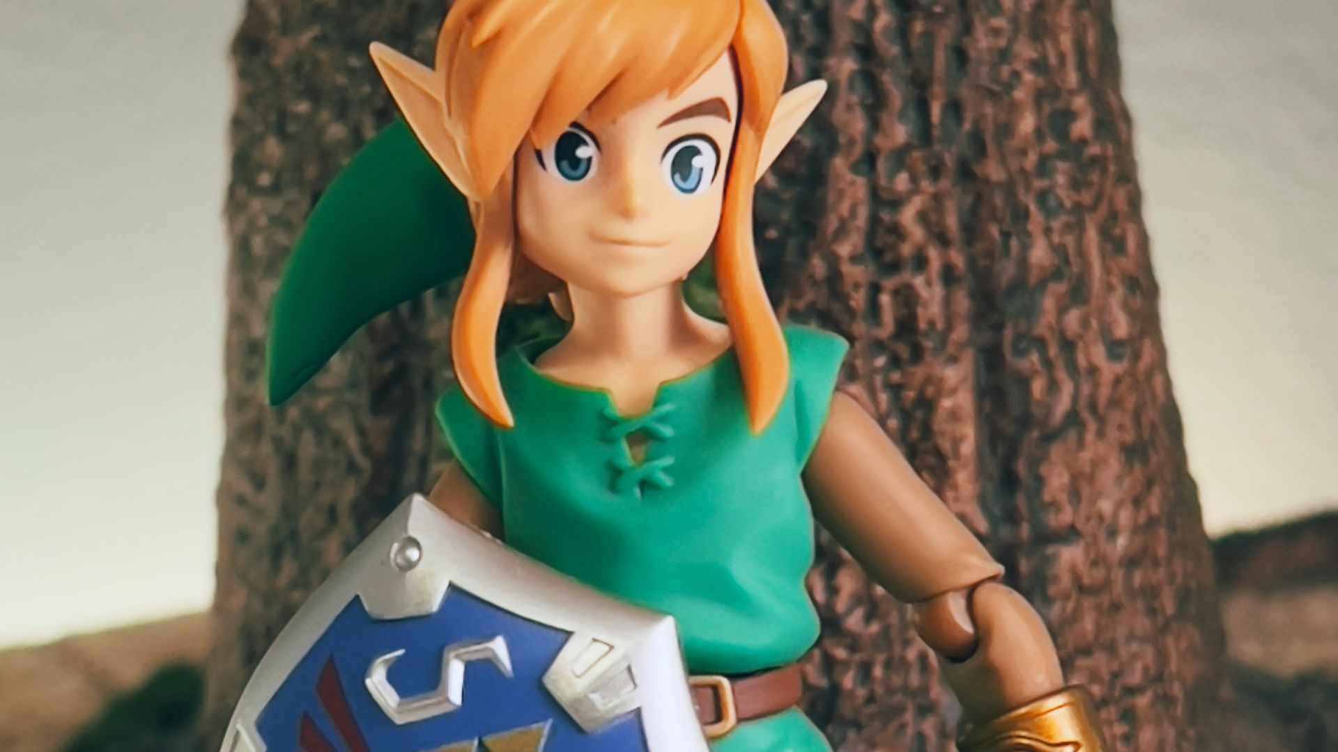 a toy girl holding a sign