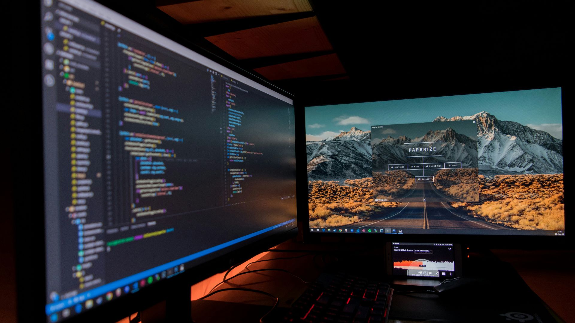 two black flat screen computer monitors