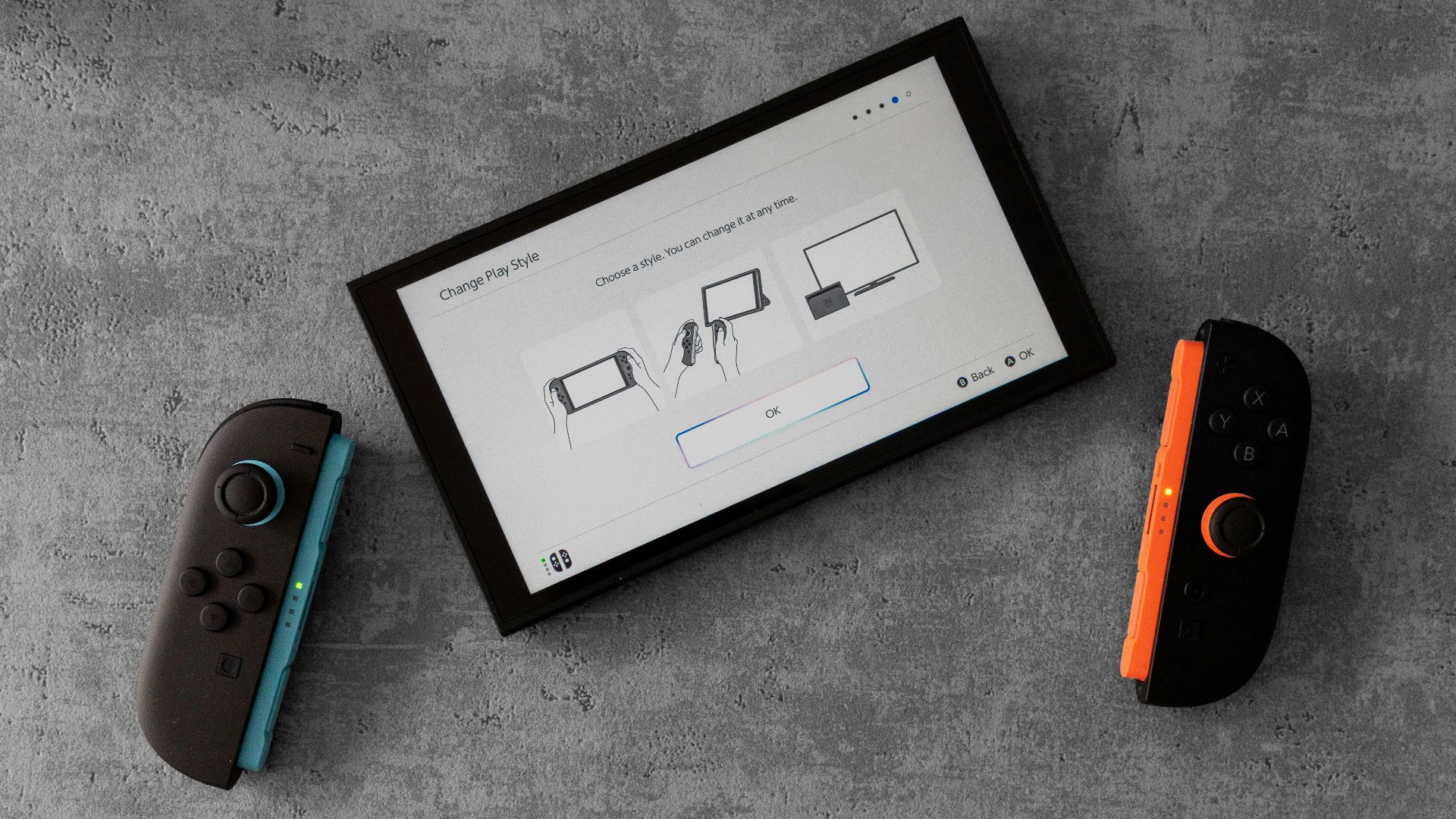 A nintendo switch console and controllers are displayed.