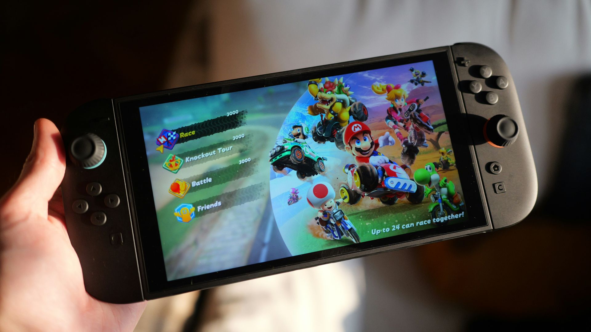 Someone is playing mario kart on a nintendo switch.