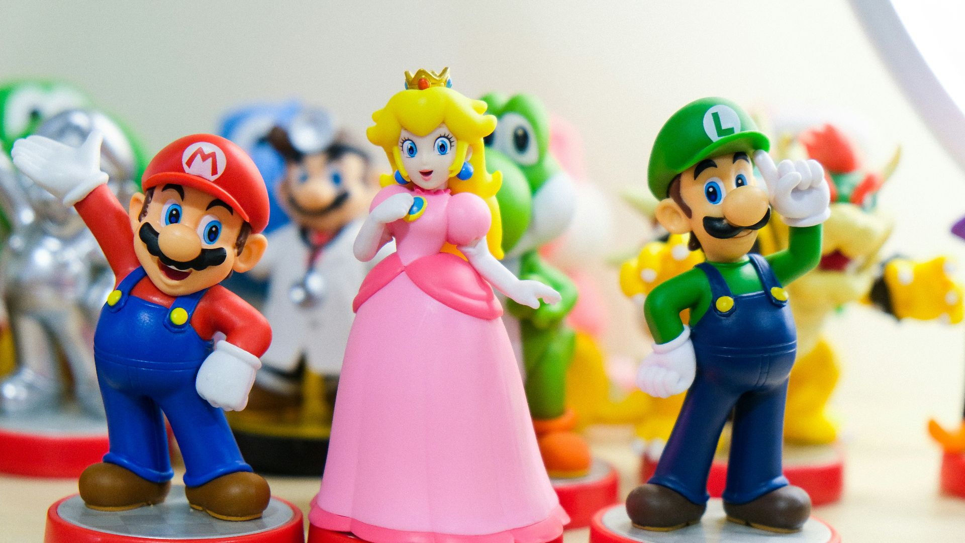 Super Mario, Luigi, and Princess Peach figurines