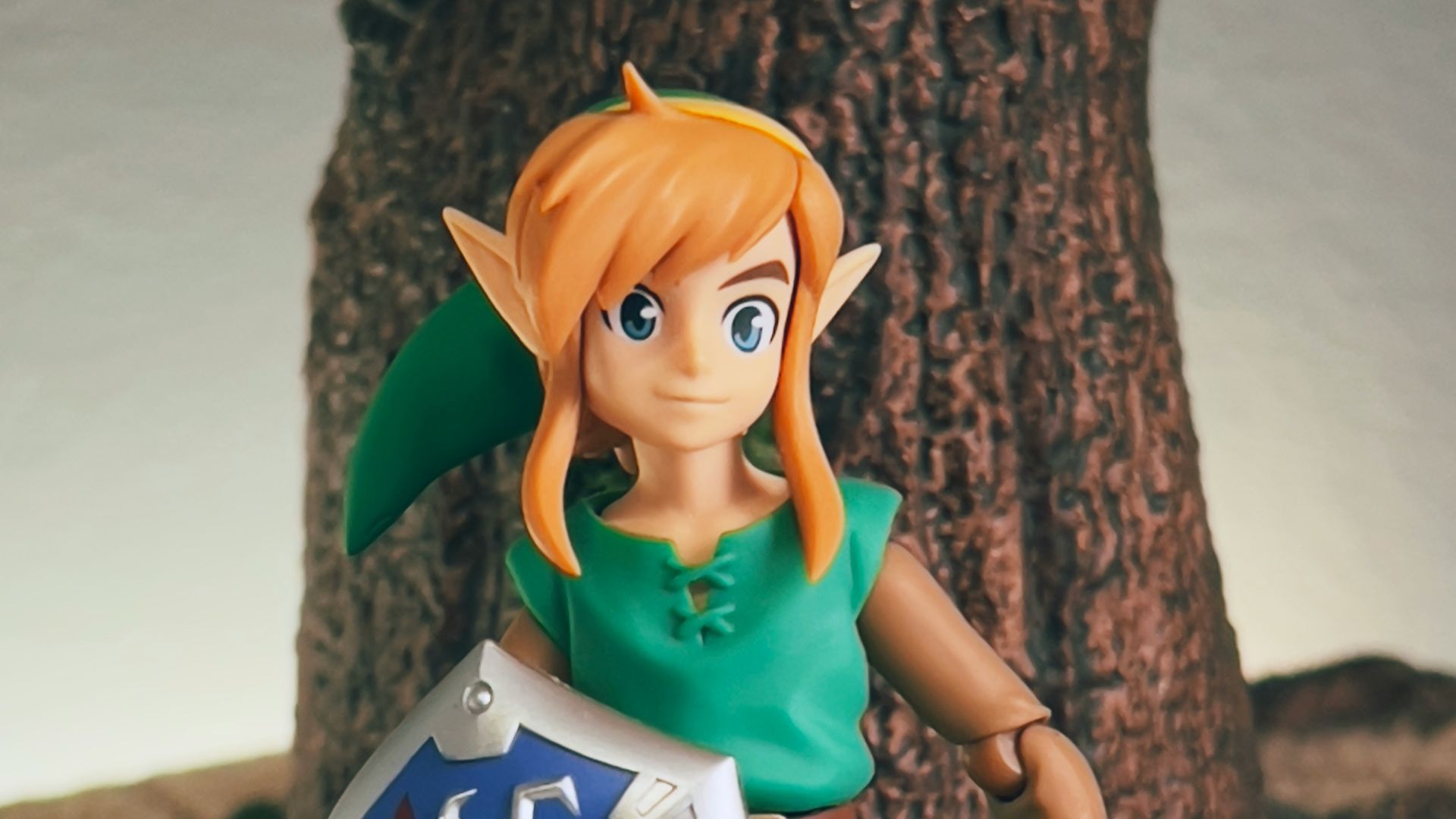 a toy girl holding a sign