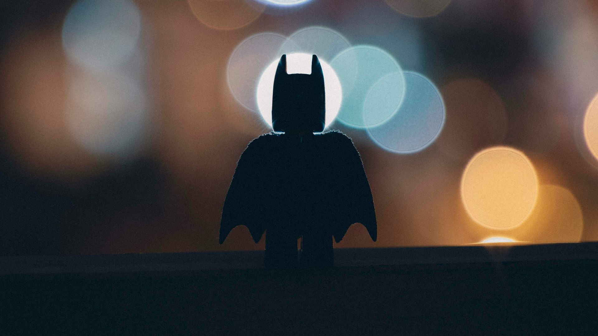 silhouette of person standing on the road during night time