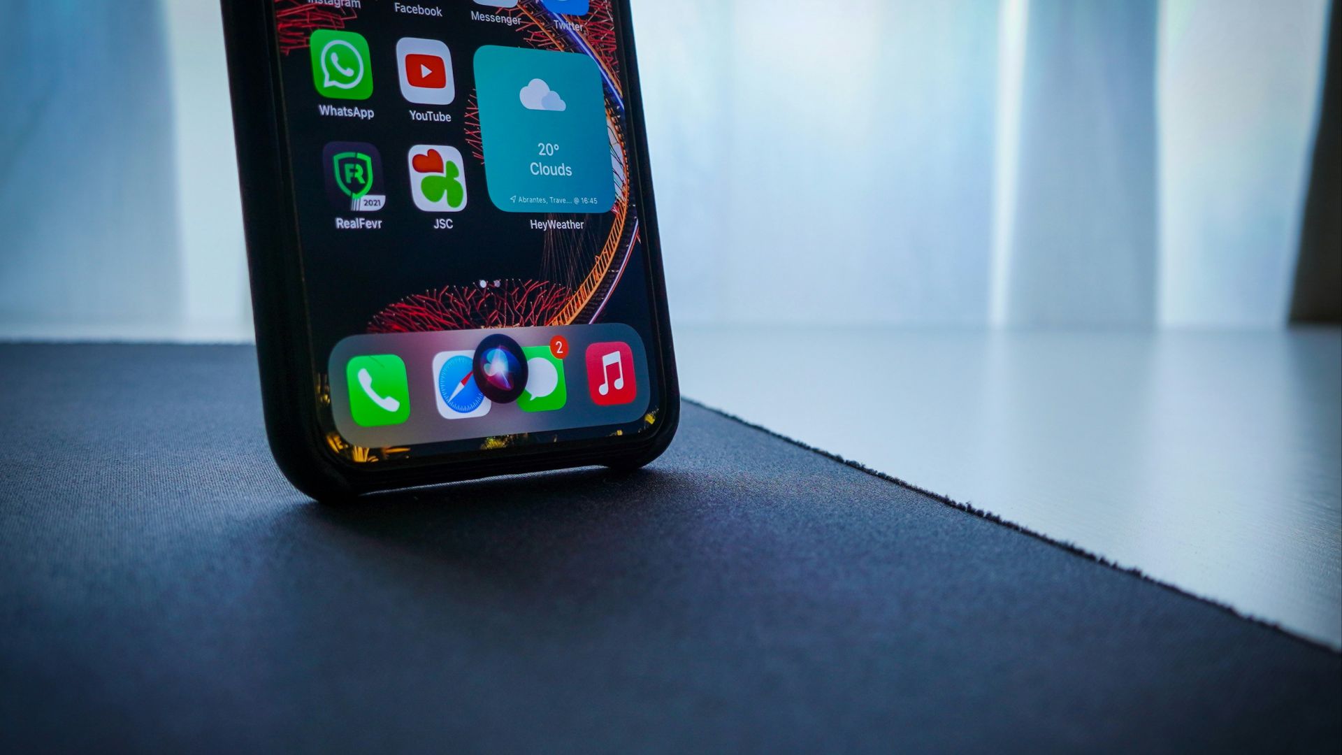 black iphone 5 on black table