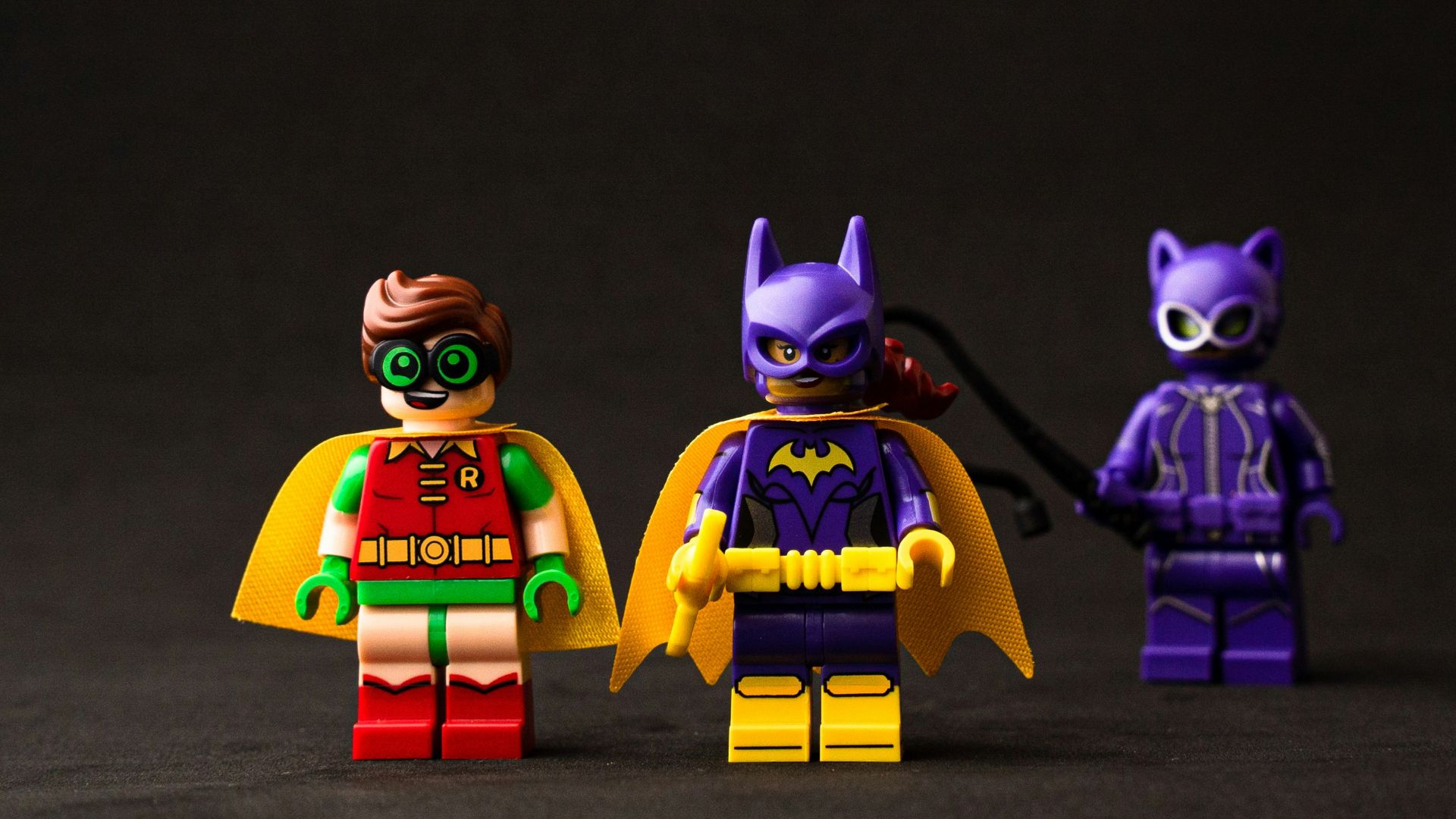 two yellow and purple robot toys