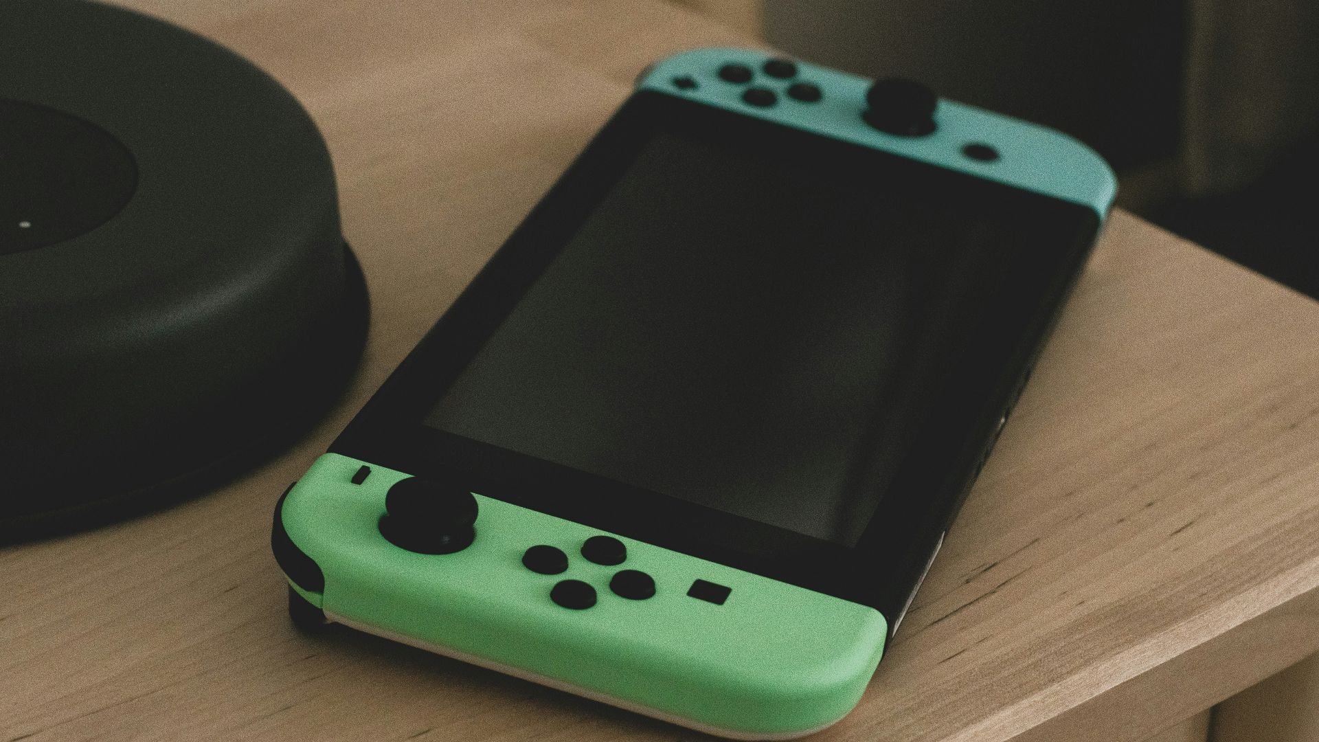 a green handheld gaming device