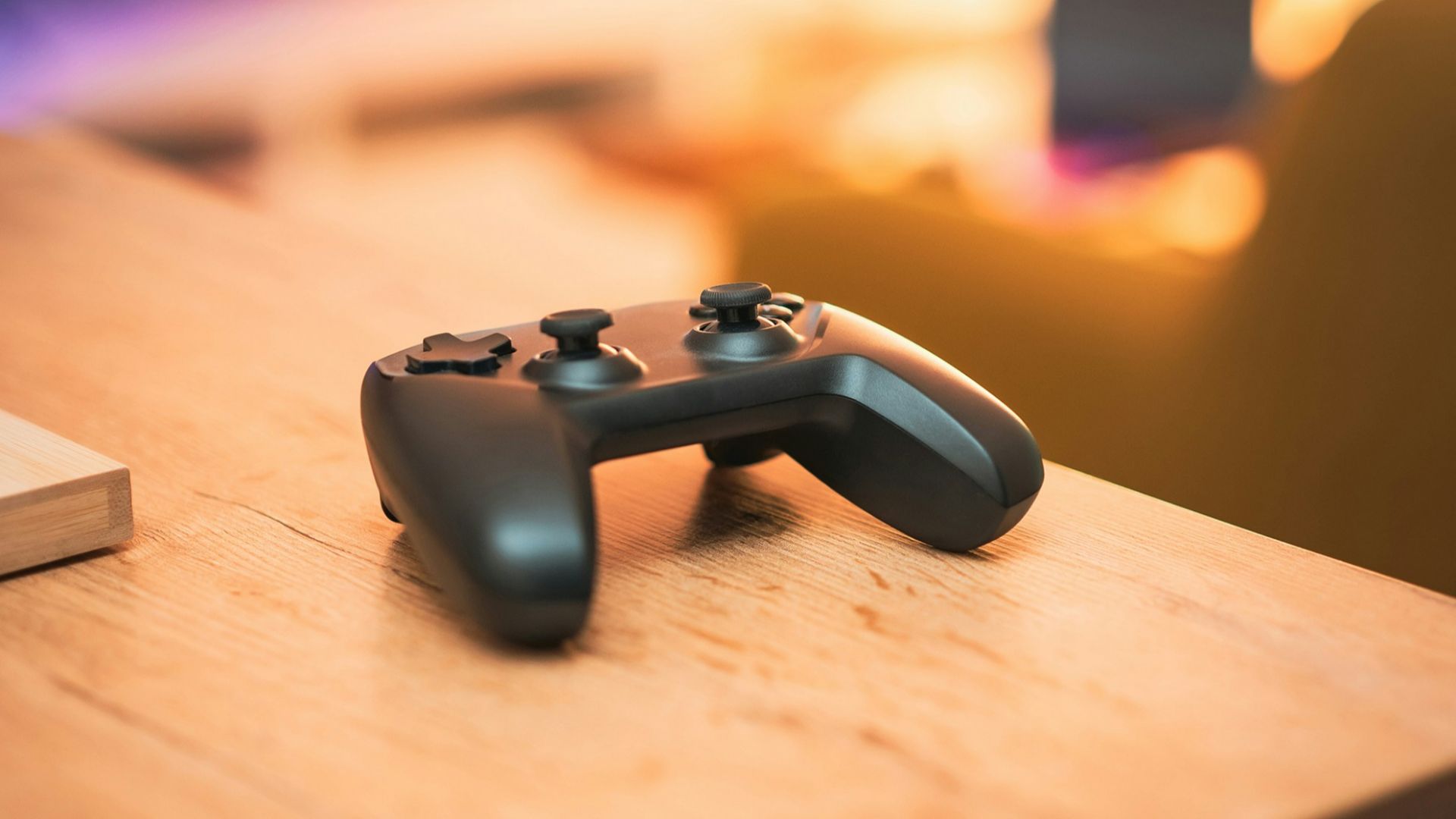 A close up of a video game controller on a table