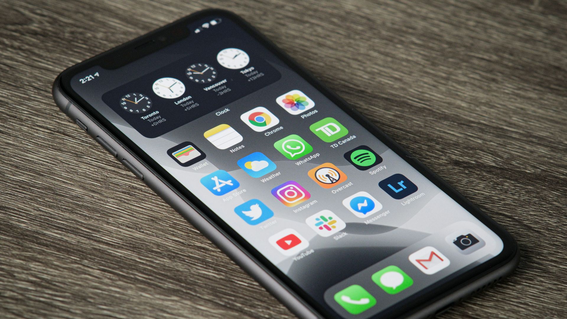 black iphone 5 on brown wooden table