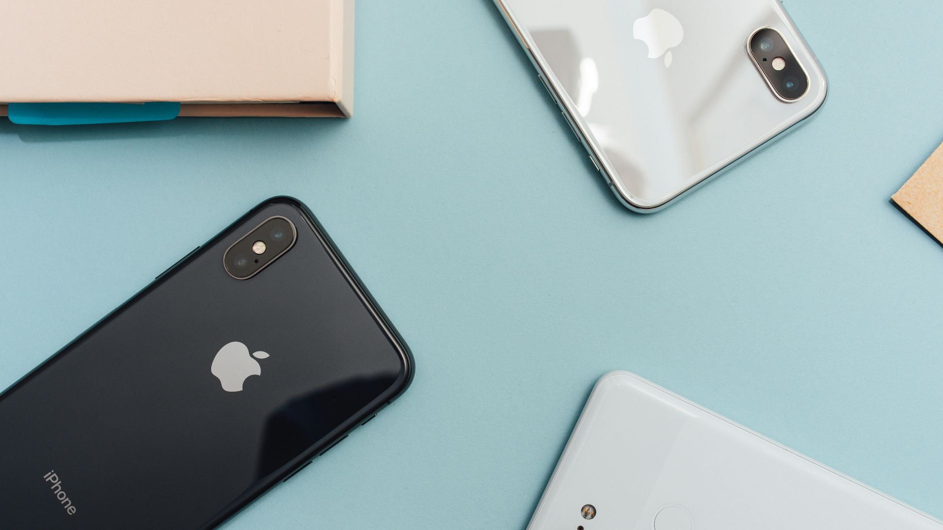 space gray iPhone X on blue surface