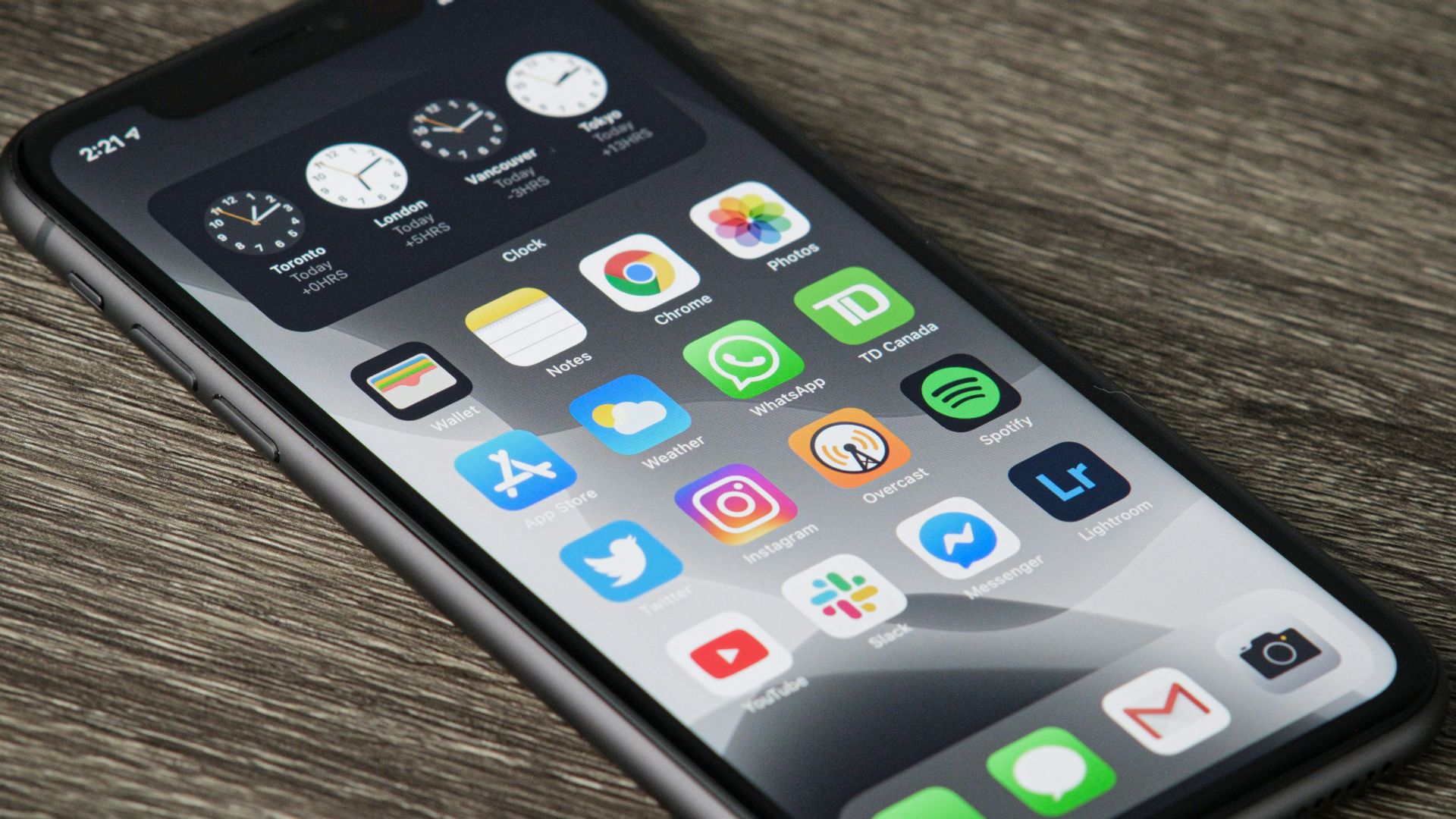 black iphone 5 on brown wooden table