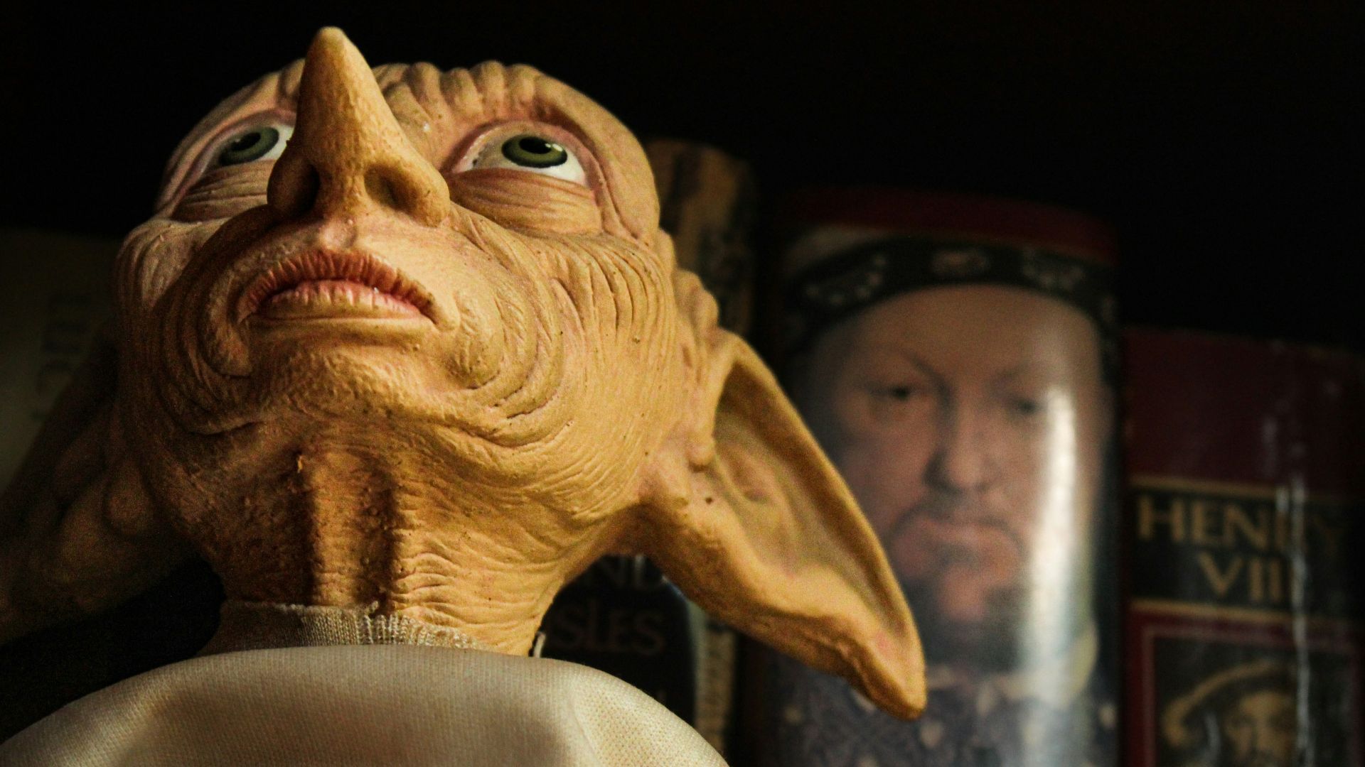 a close up of a statue of an old man