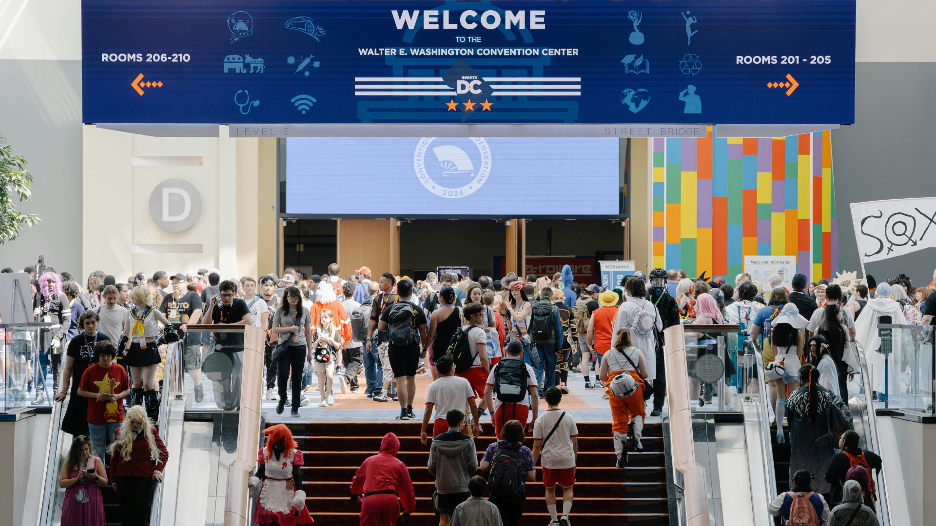 A group of people walking up and down a flight of stairs
