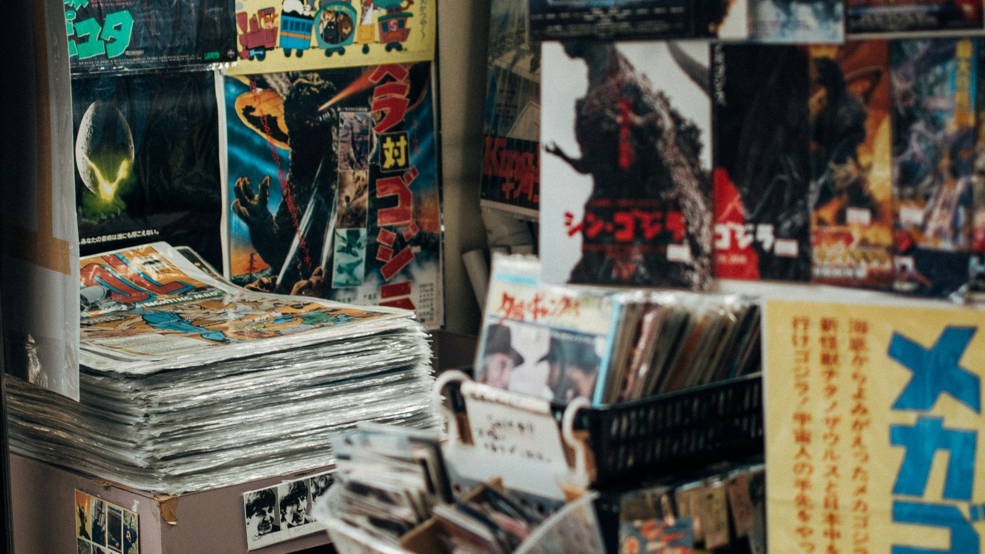 assorted magazines on white wooden shelf