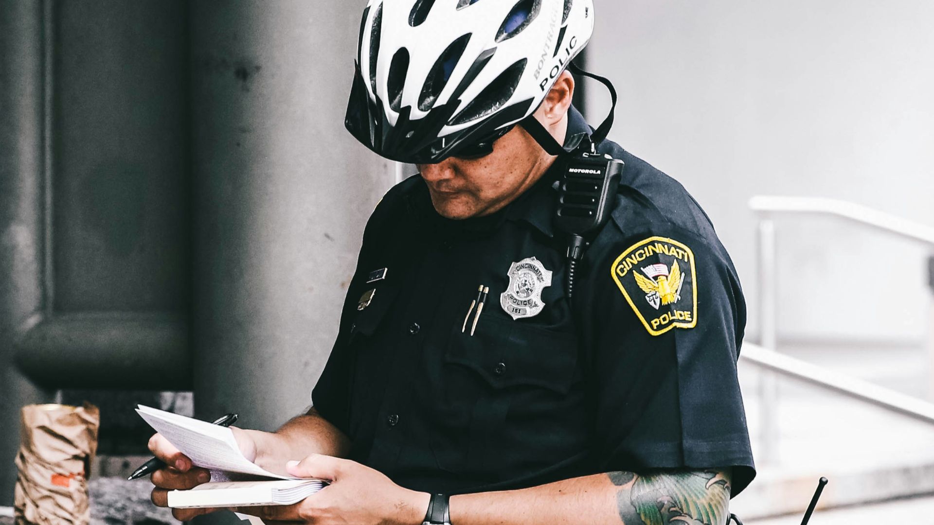 officer reading notes