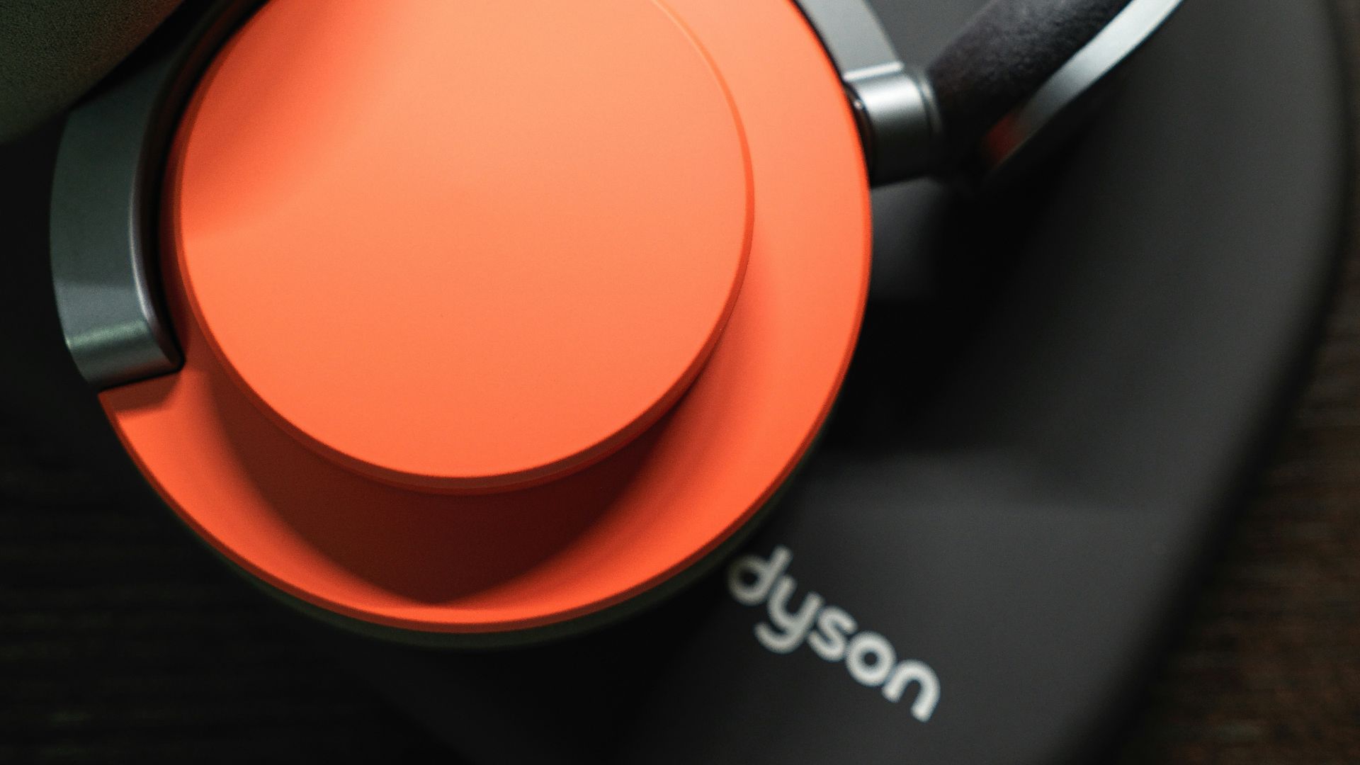 A pair of headphones sitting on top of a wooden table