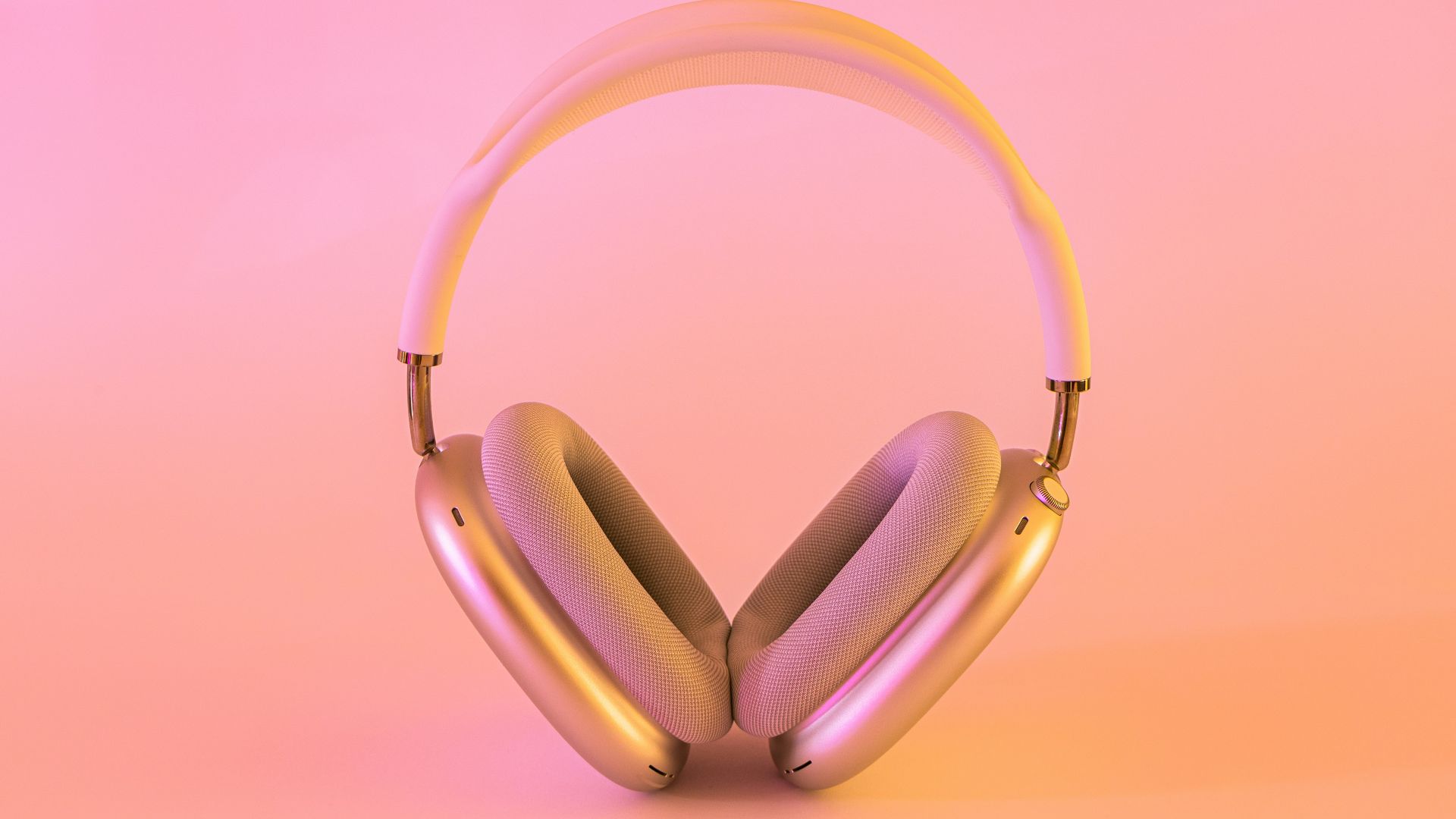 pink and white wireless headphones