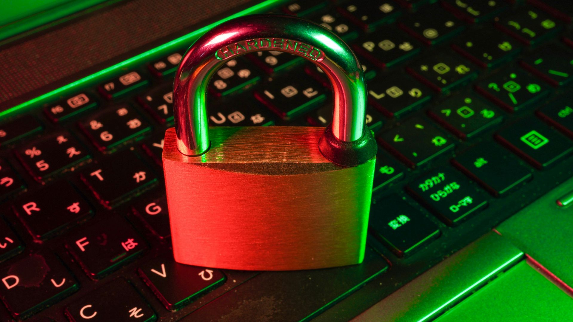 red padlock on black computer keyboard